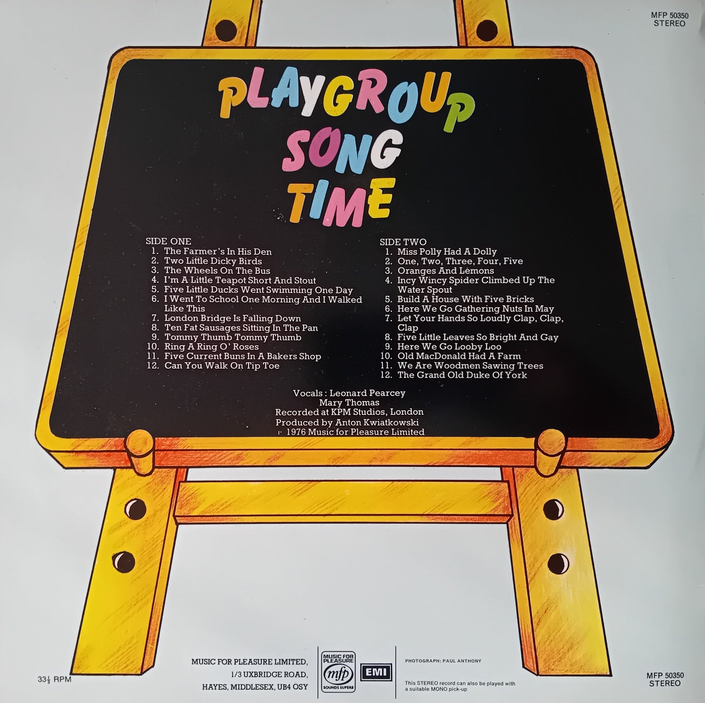 Album cover with a blackboard design featuring colorful text and song list on a white background.