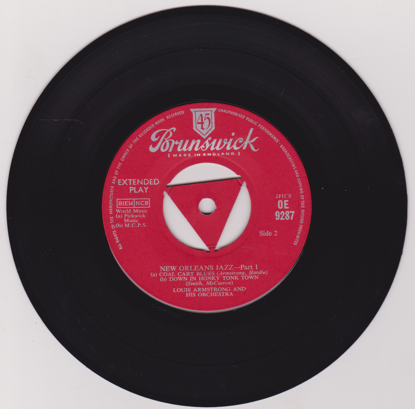 Vinyl record with red label on white background
