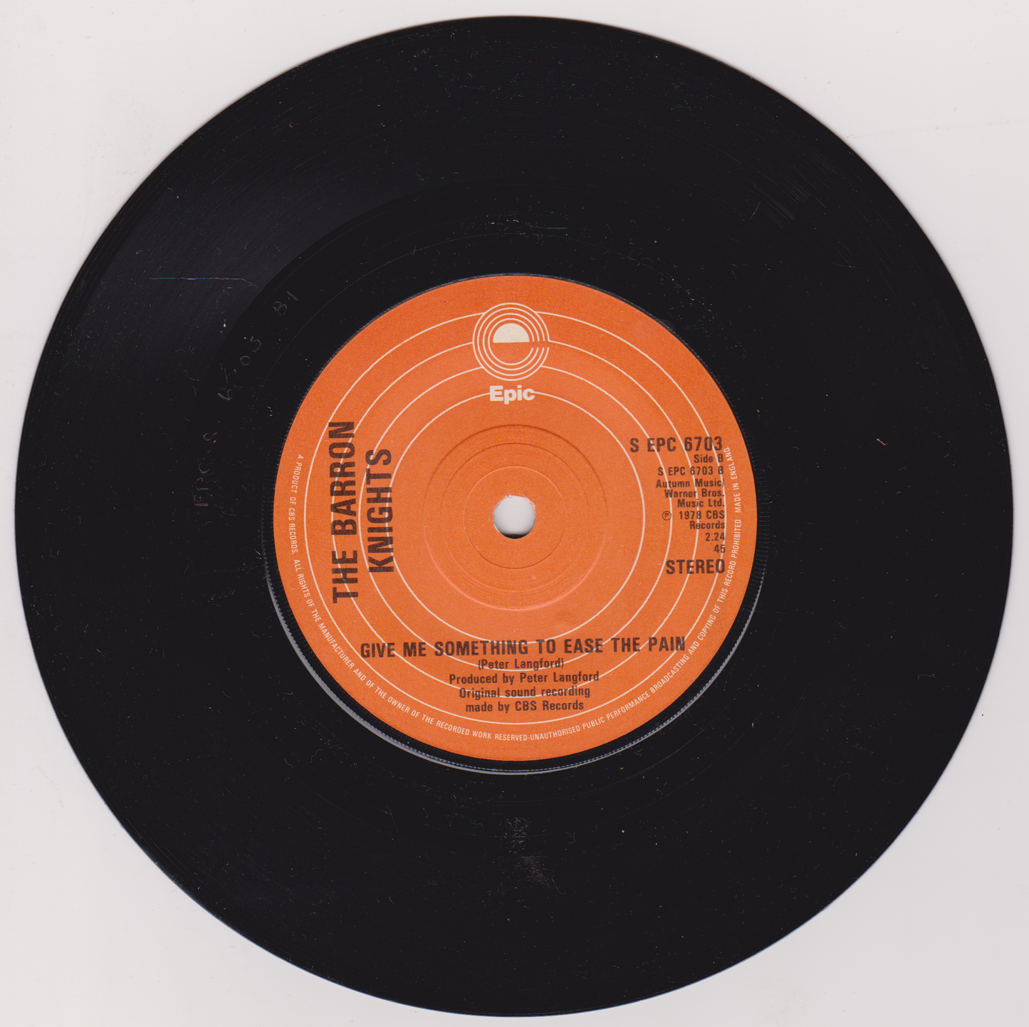 Vinyl record with orange label on white background