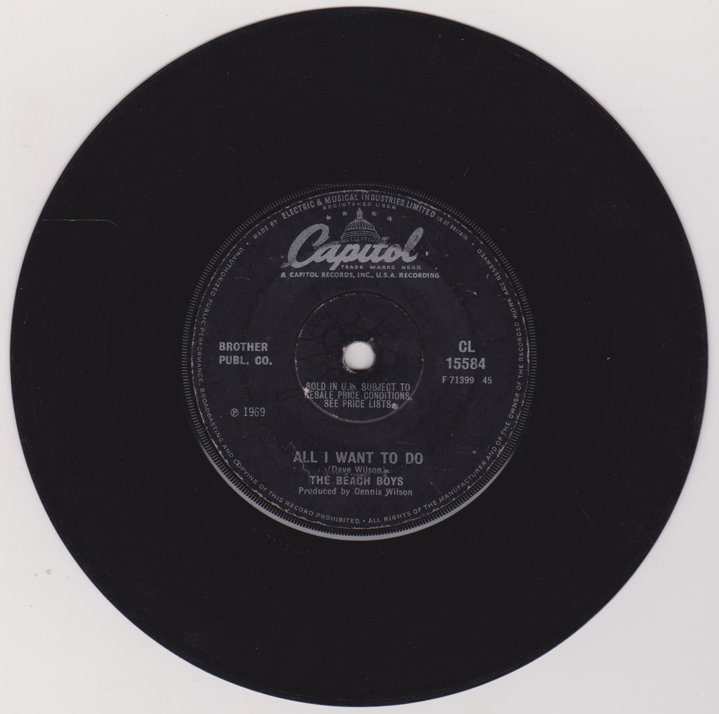 Black vinyl record with Capitol label and 'All I Want to Do' by The Beach Boys on a white background