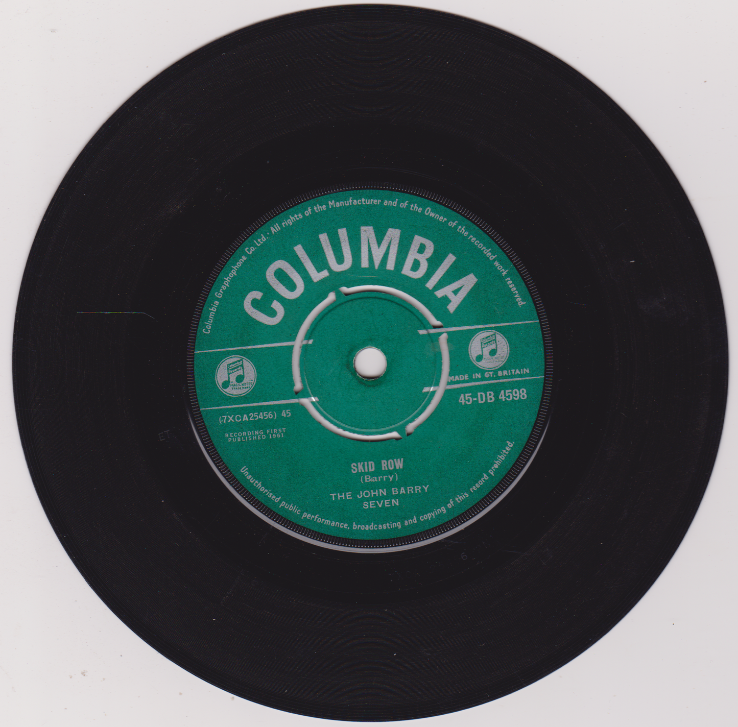 Black vinyl record with a green Columbia label on a white background