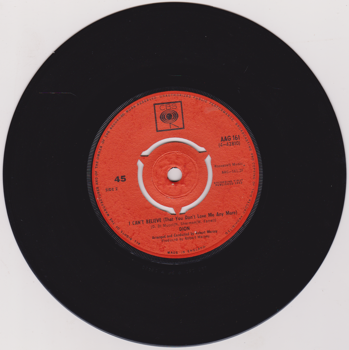 Vinyl record with a red label on a white background