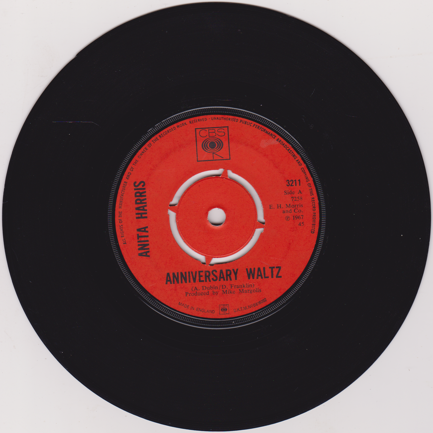 Vinyl record with a red label featuring 'Anita Harris' and 'Anniversary Waltz'.