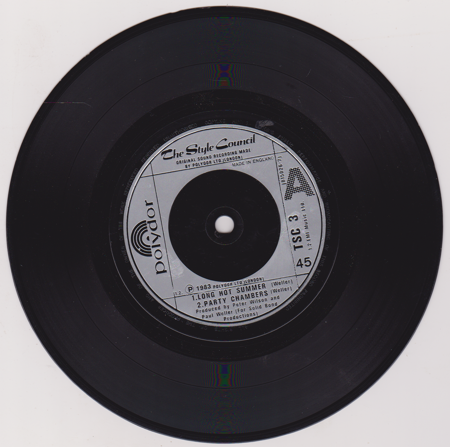 Black vinyl record with label on a white background