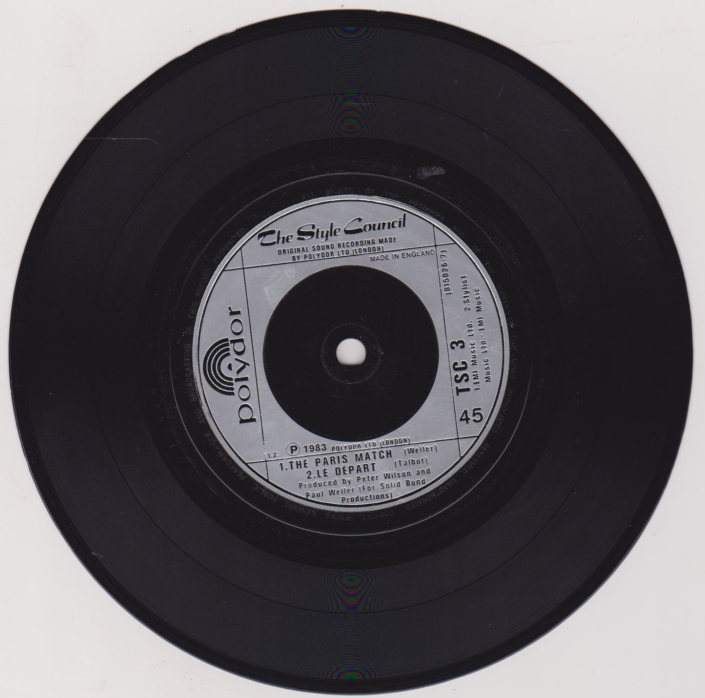 Black vinyl record with label on a white background