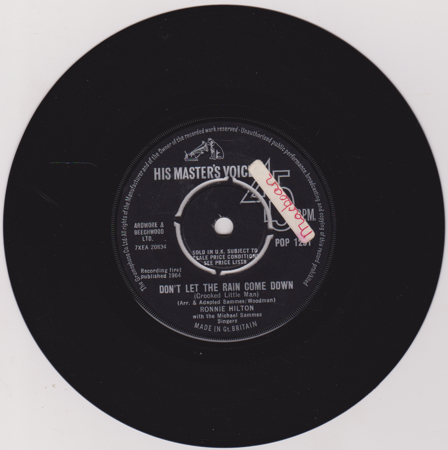 Black vinyl record with a label on a white background