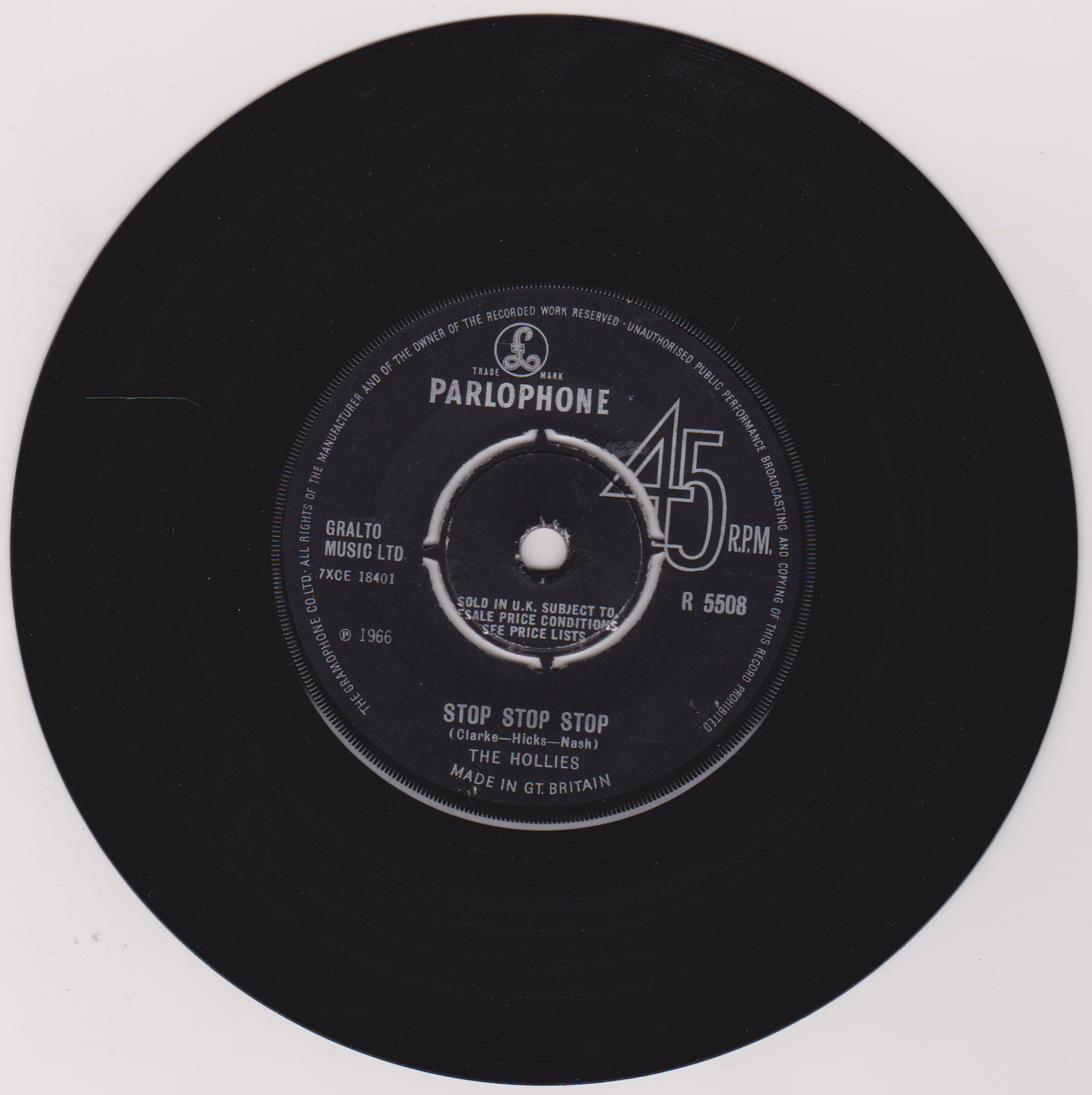 Black vinyl record with Parlophone label on a white background