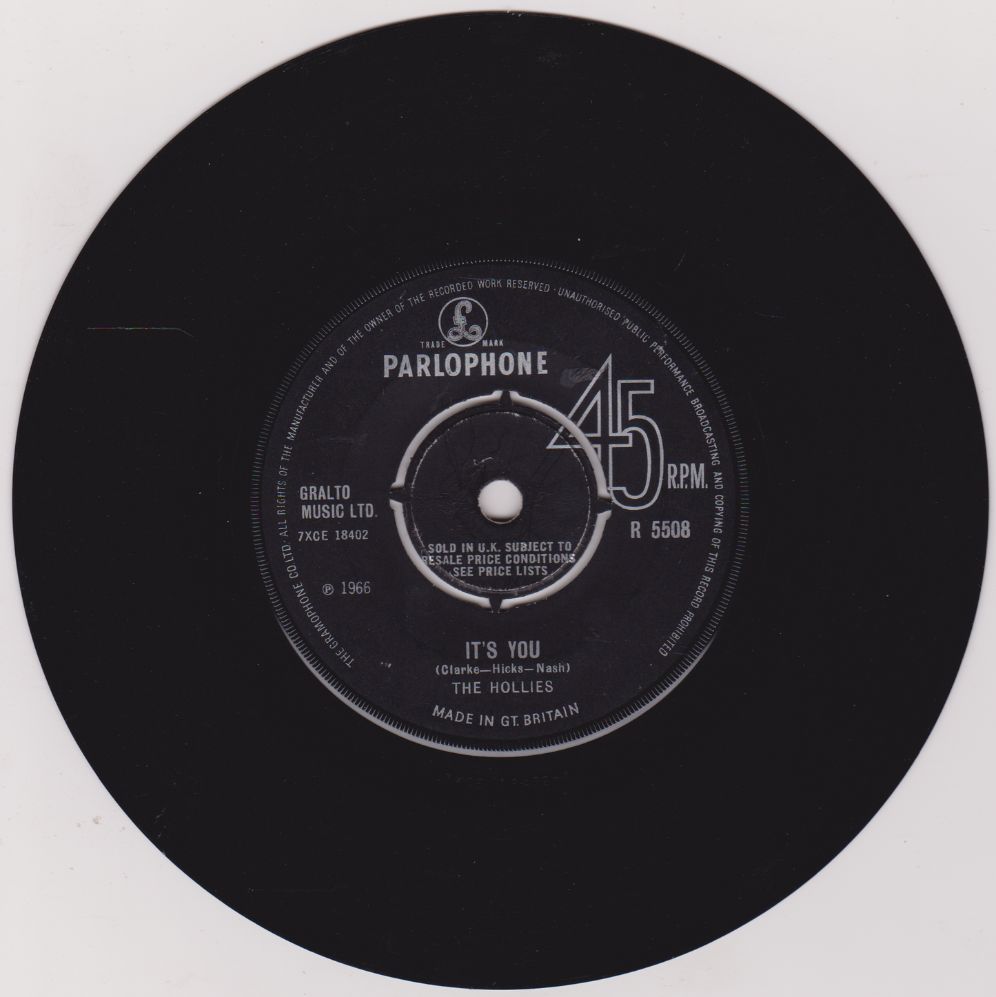 Black vinyl record with Parlophone label on a white background
