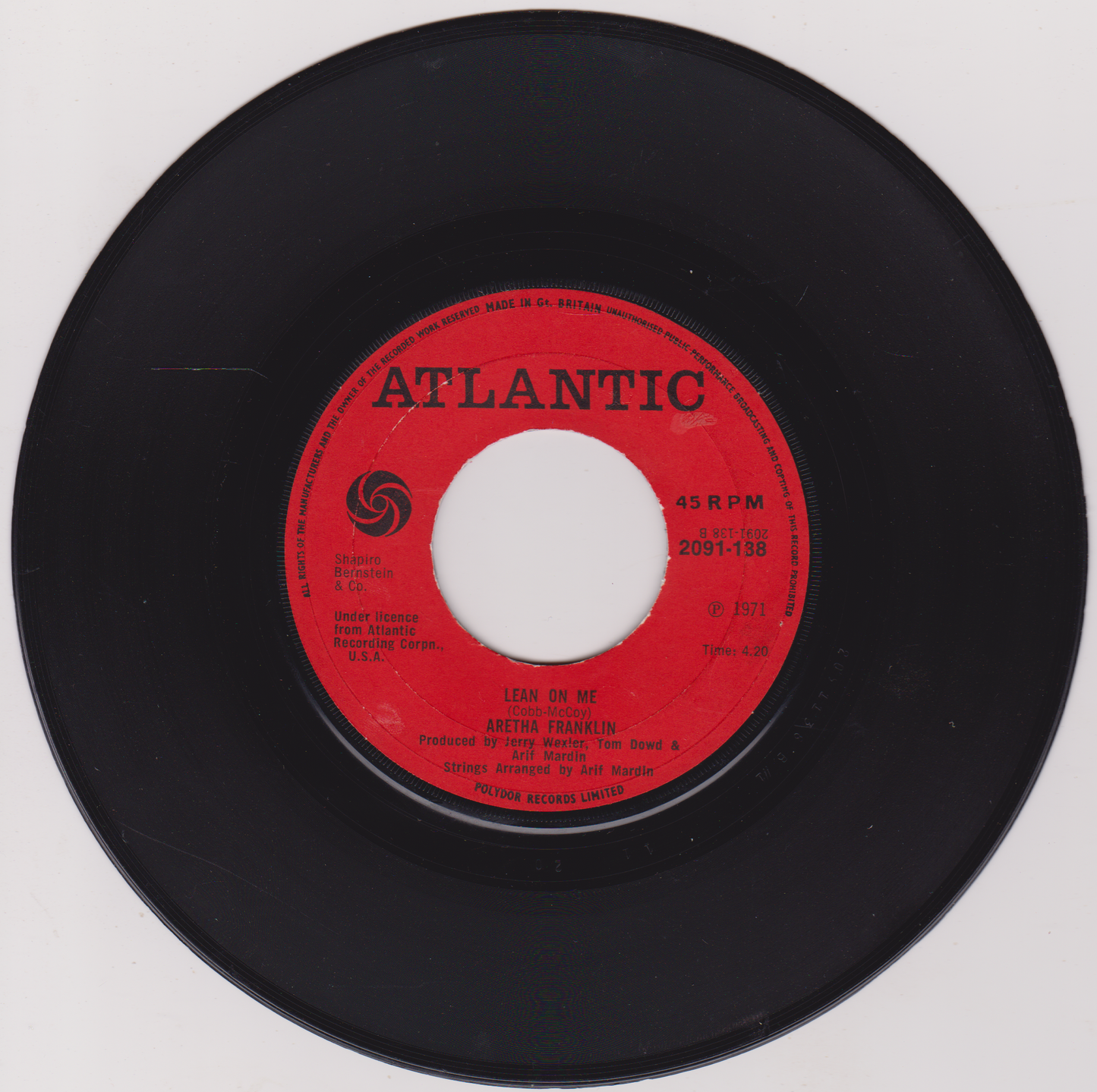 Black vinyl record with a red label featuring the Atlantic Records logo on a white background