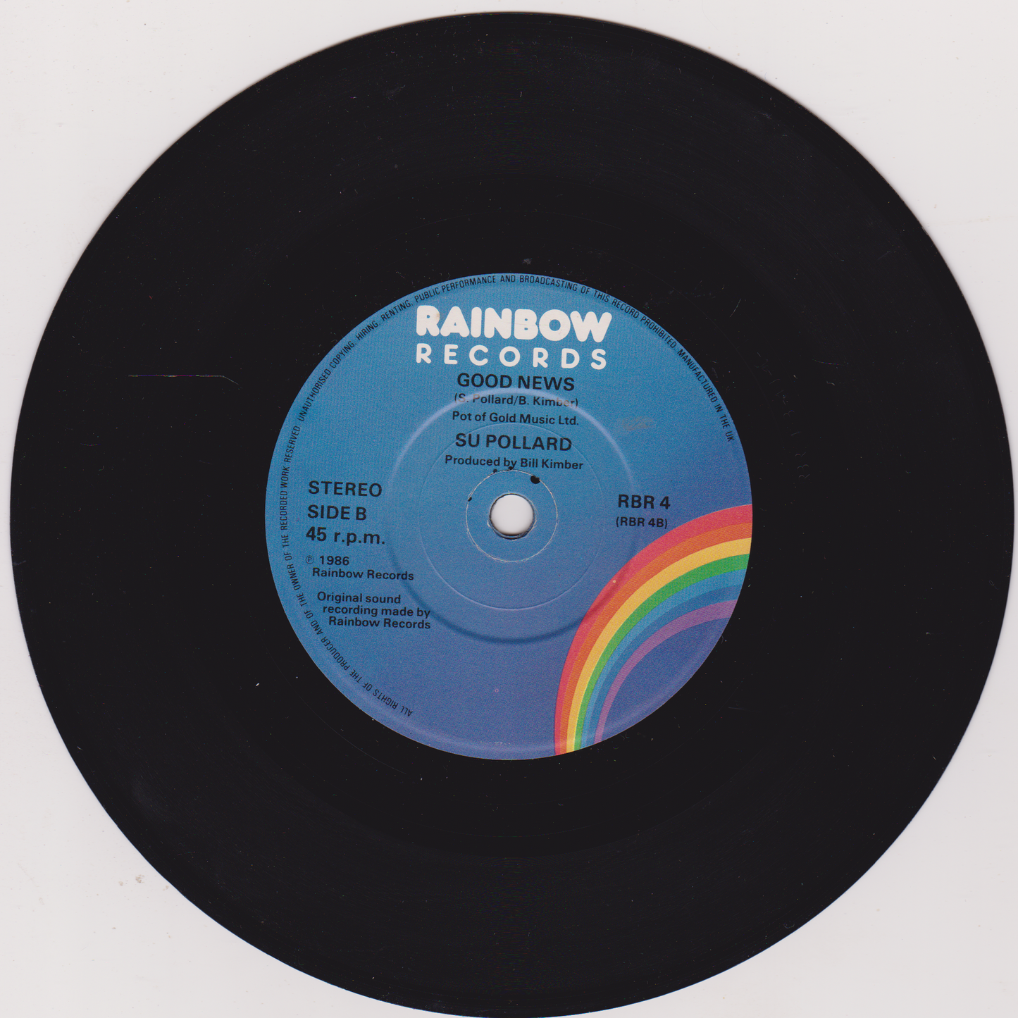 Vinyl record with a blue label featuring a rainbow design, labeled 'Rainbow Records'.