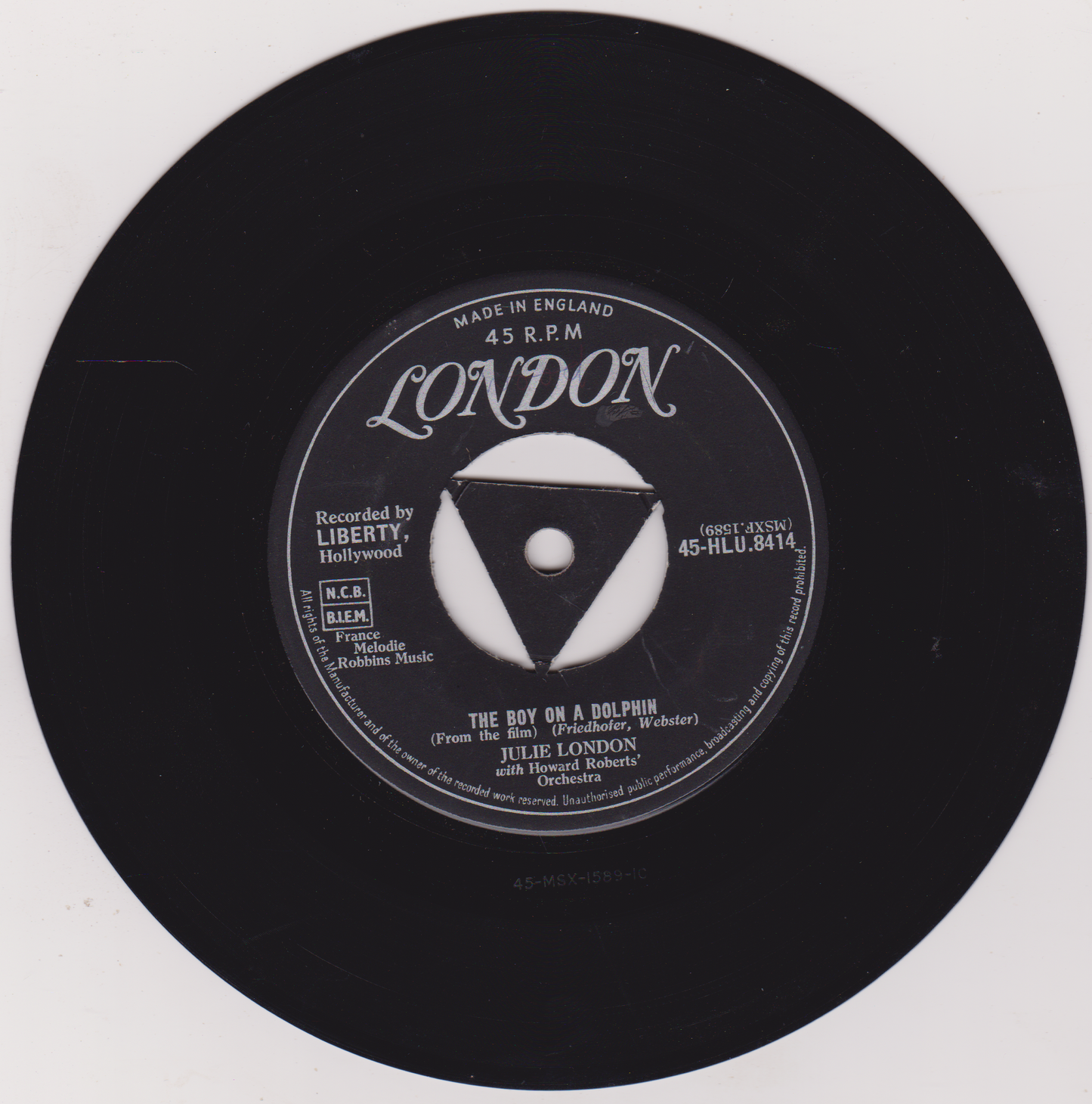 Black vinyl record label with text and a logo on a white background