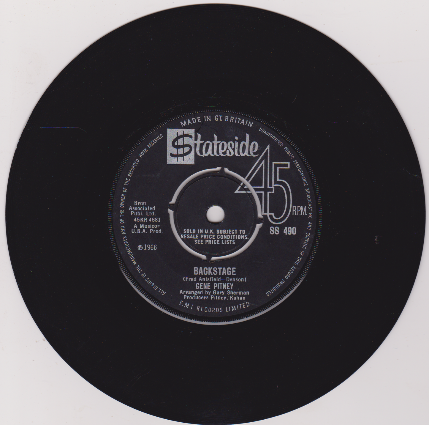 Black vinyl record label with text and branding on a white background