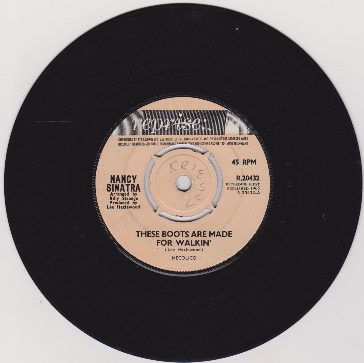 Vinyl record with Nancy Sinatra's 'These Boots Are Made for Walkin'' on a white background