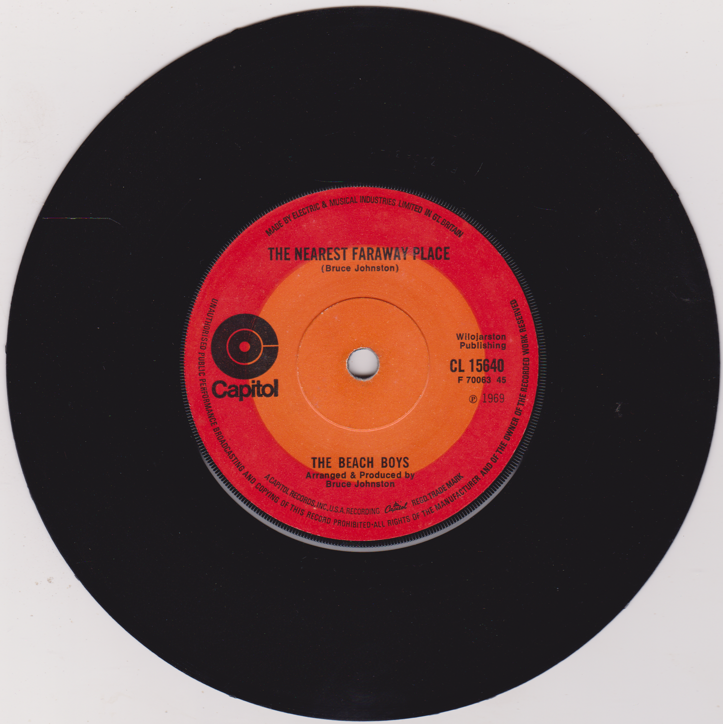 Vinyl record with red label featuring 'The Beach Boys' on a white background