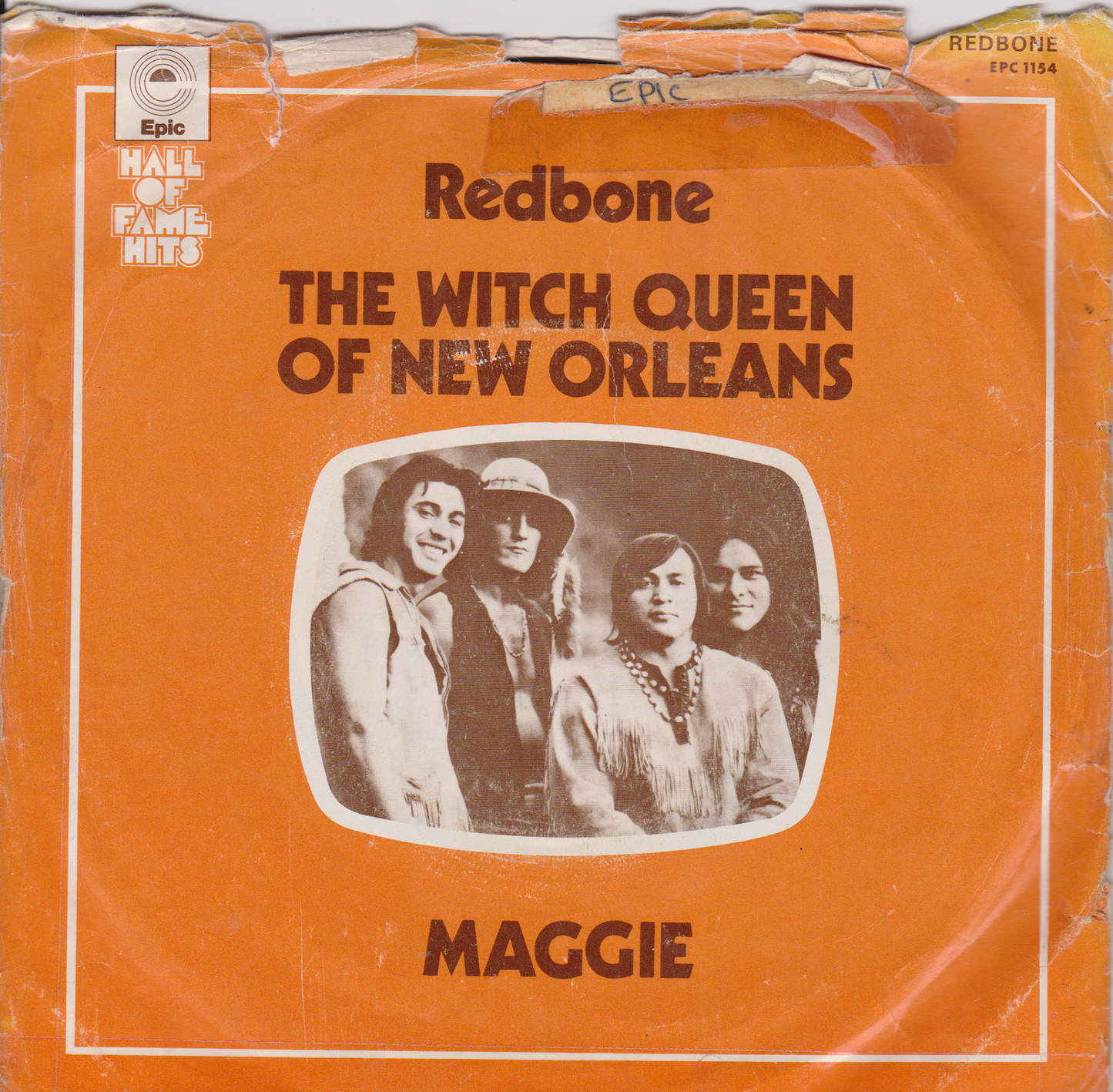 Single cover by Redbone featuring a group of people with an orange background.