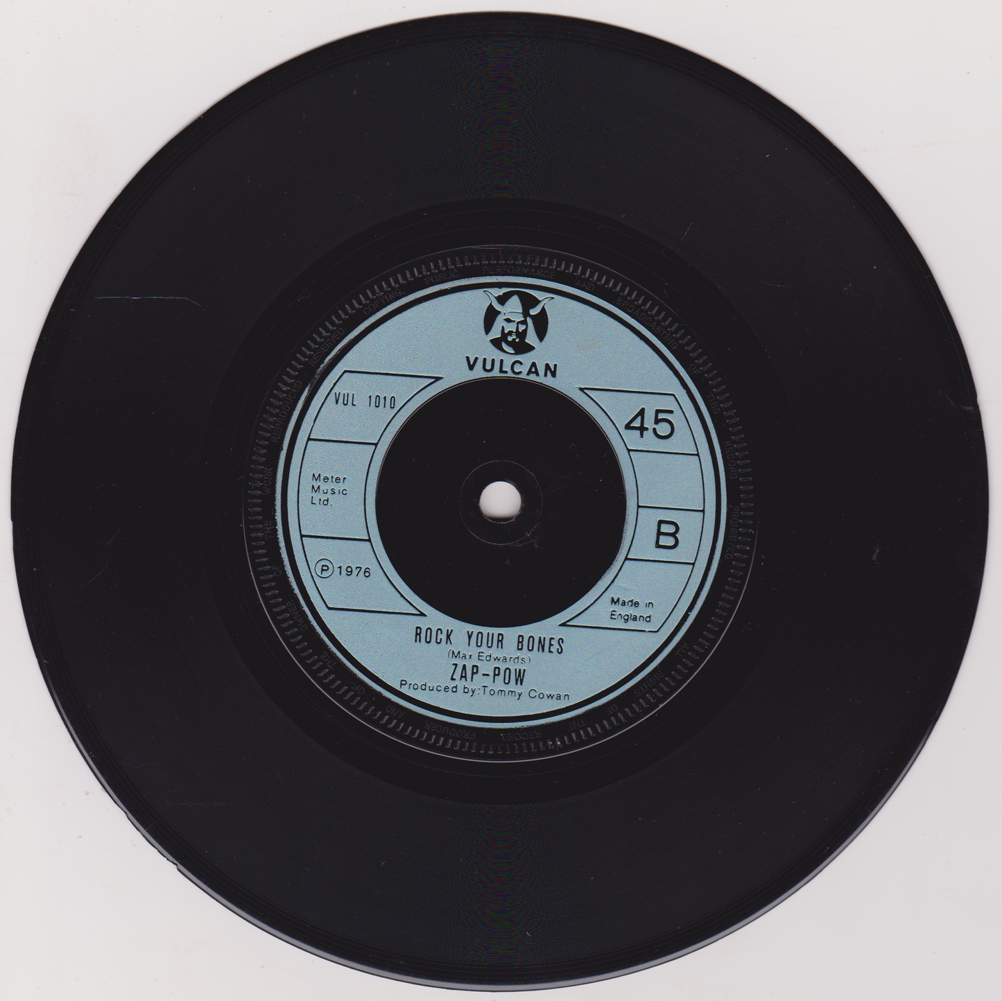 Vinyl record with a visible label on a white background