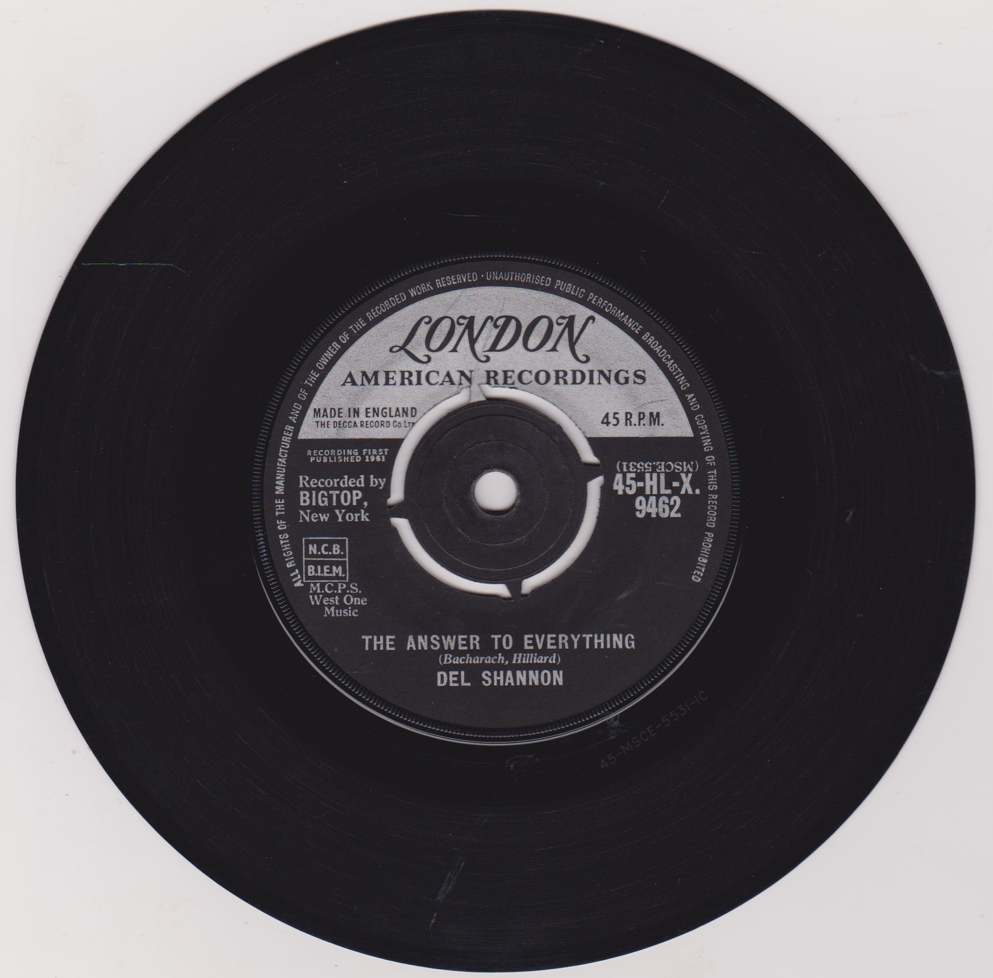 Black vinyl record with 'London American Recordings' label on a white background
