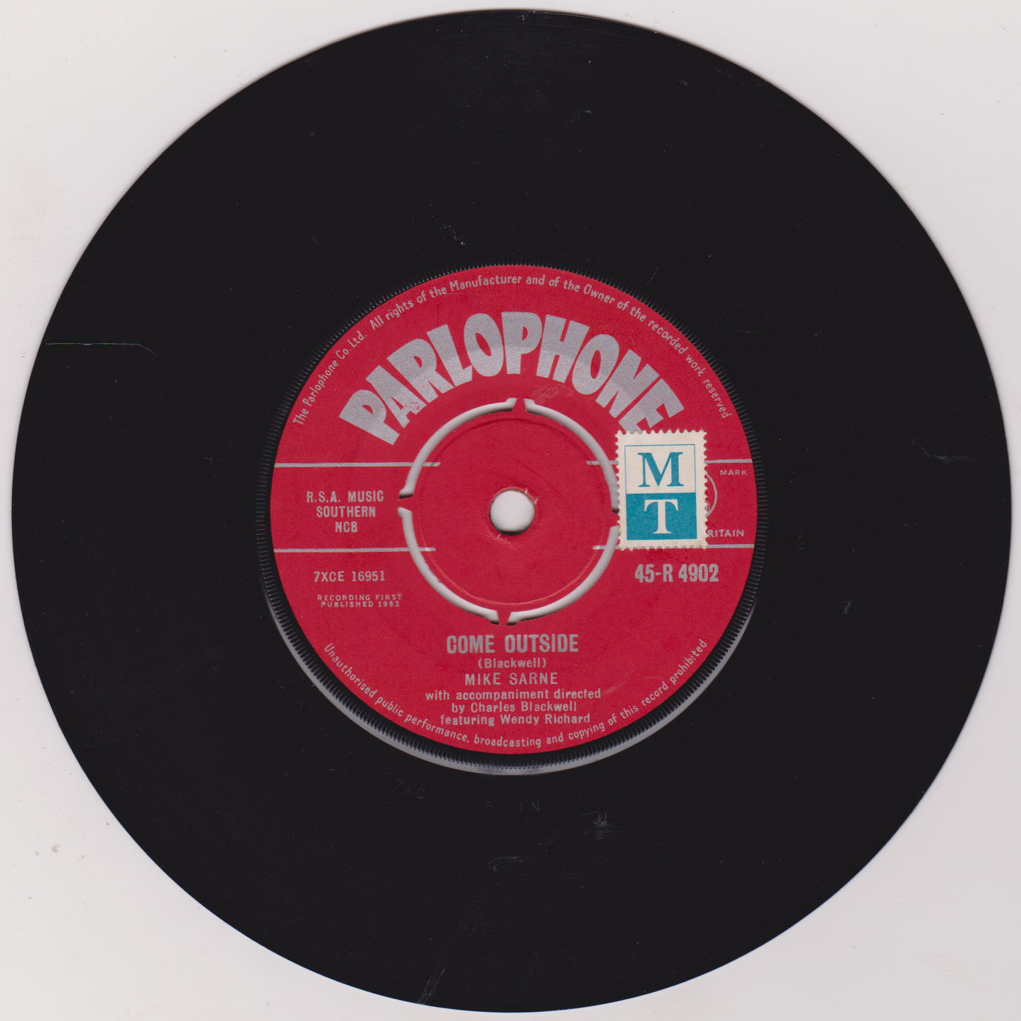 Parlophone record label on a black vinyl record with red label