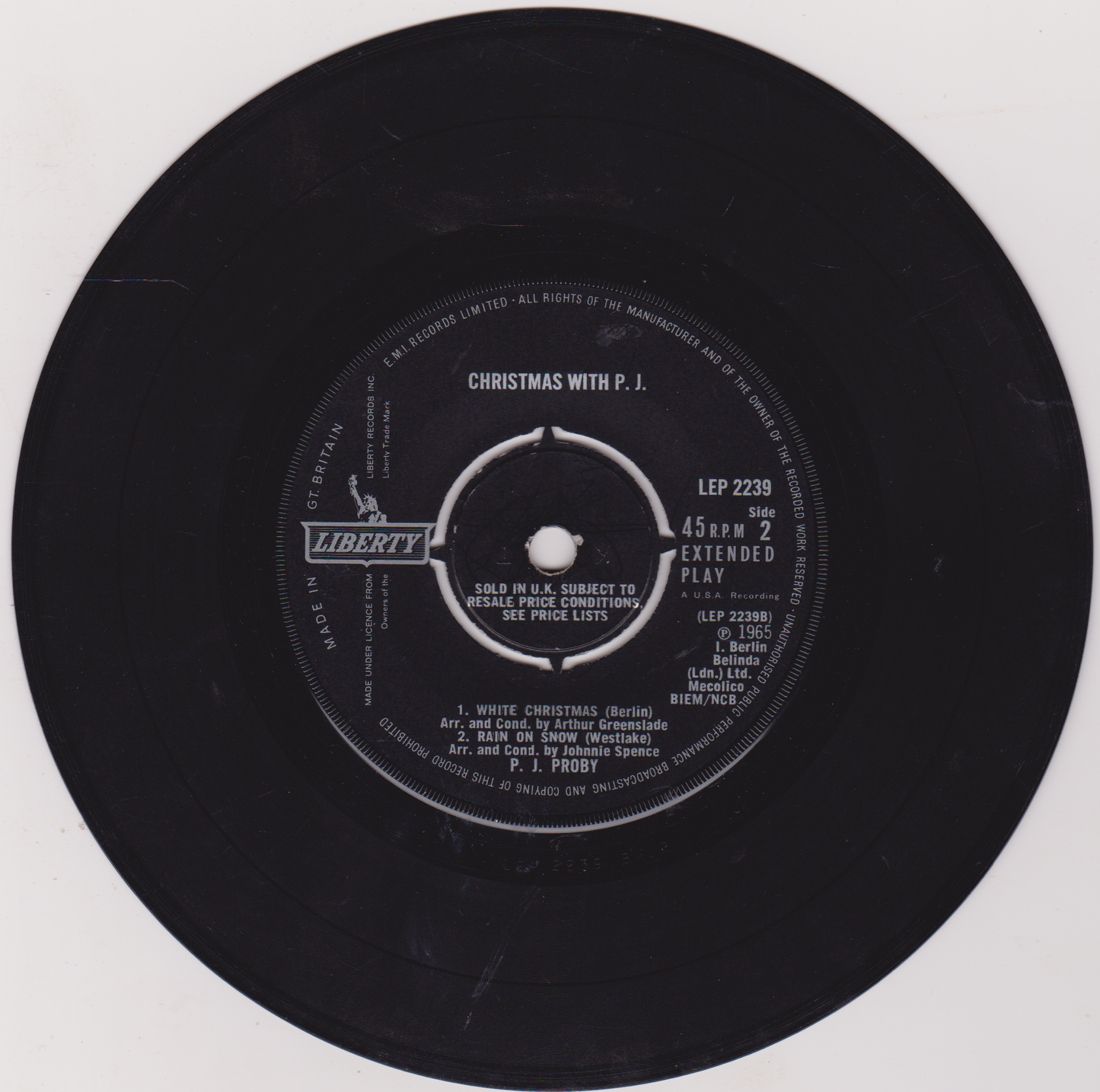 Vinyl record label with text and branding on a white background