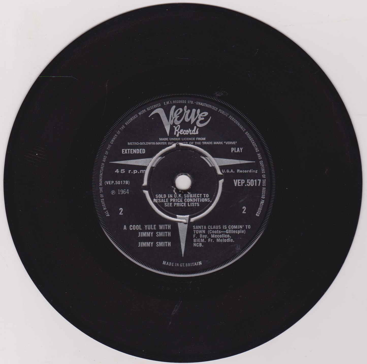 Black vinyl record with Verve Records label on a white background