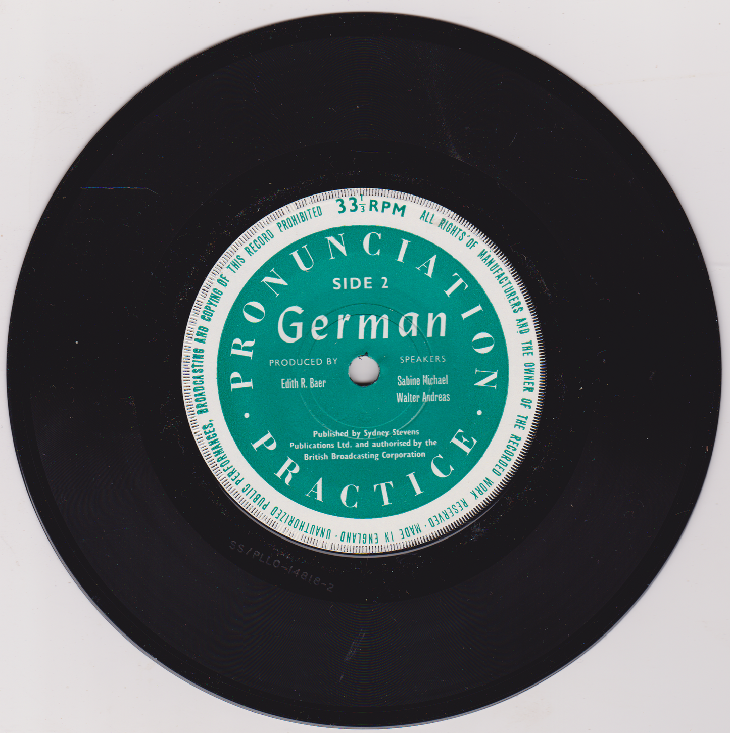 Black vinyl record with a green label titled 'Pronunciation Practice German' on a white background