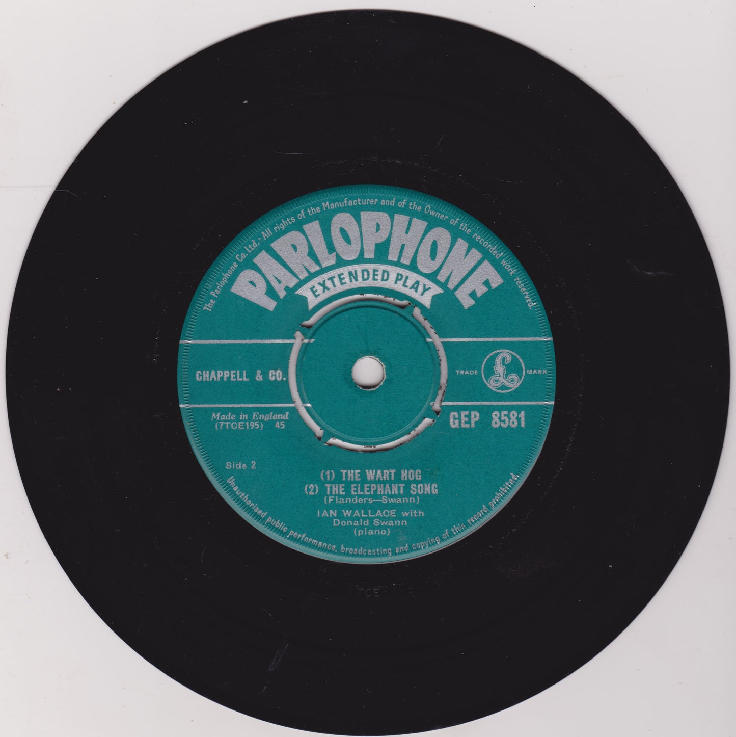 Parlophone extended play record label on a black vinyl record with a white background