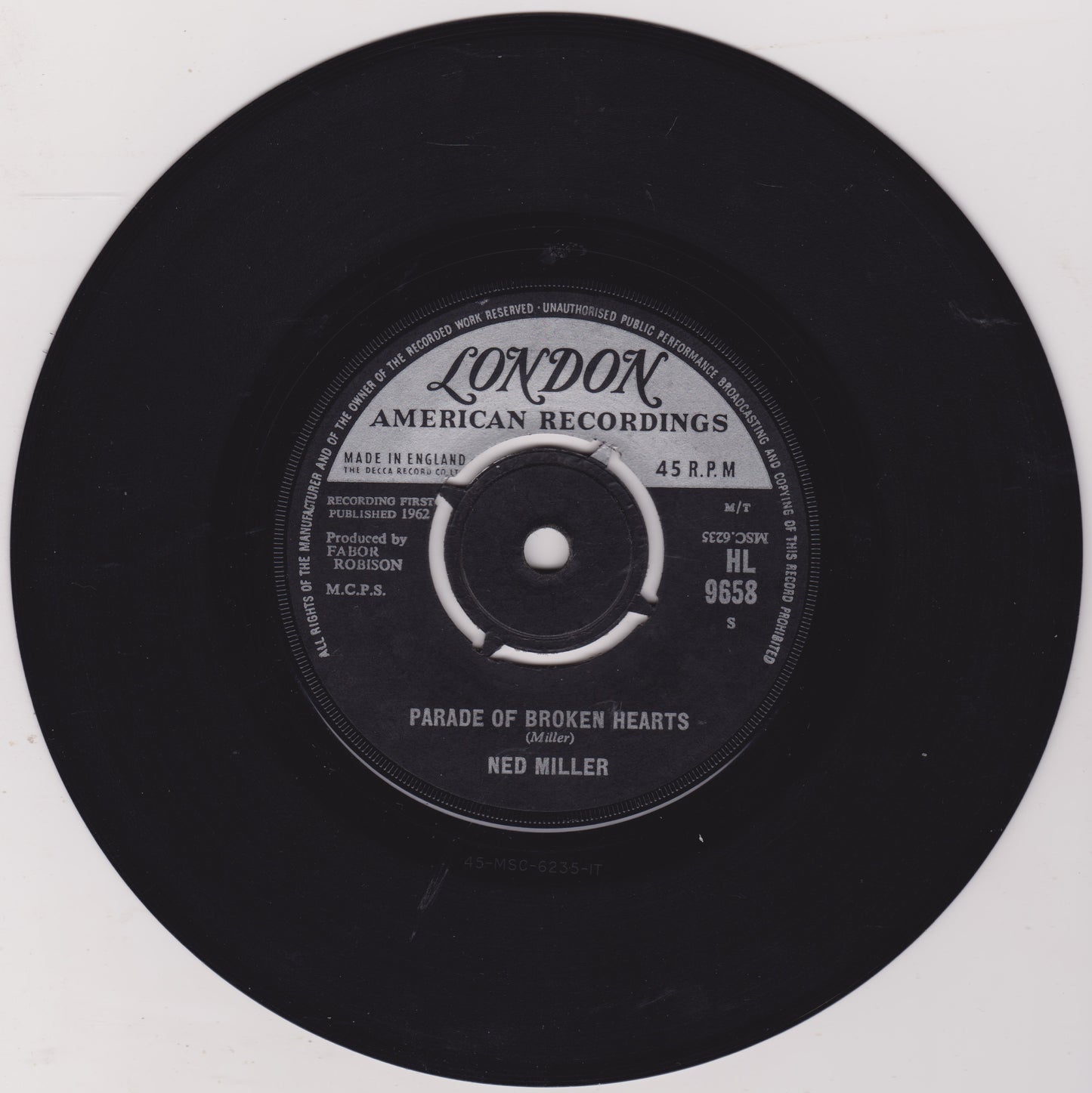 Black vinyl record with 'London American Recordings' label on a white background