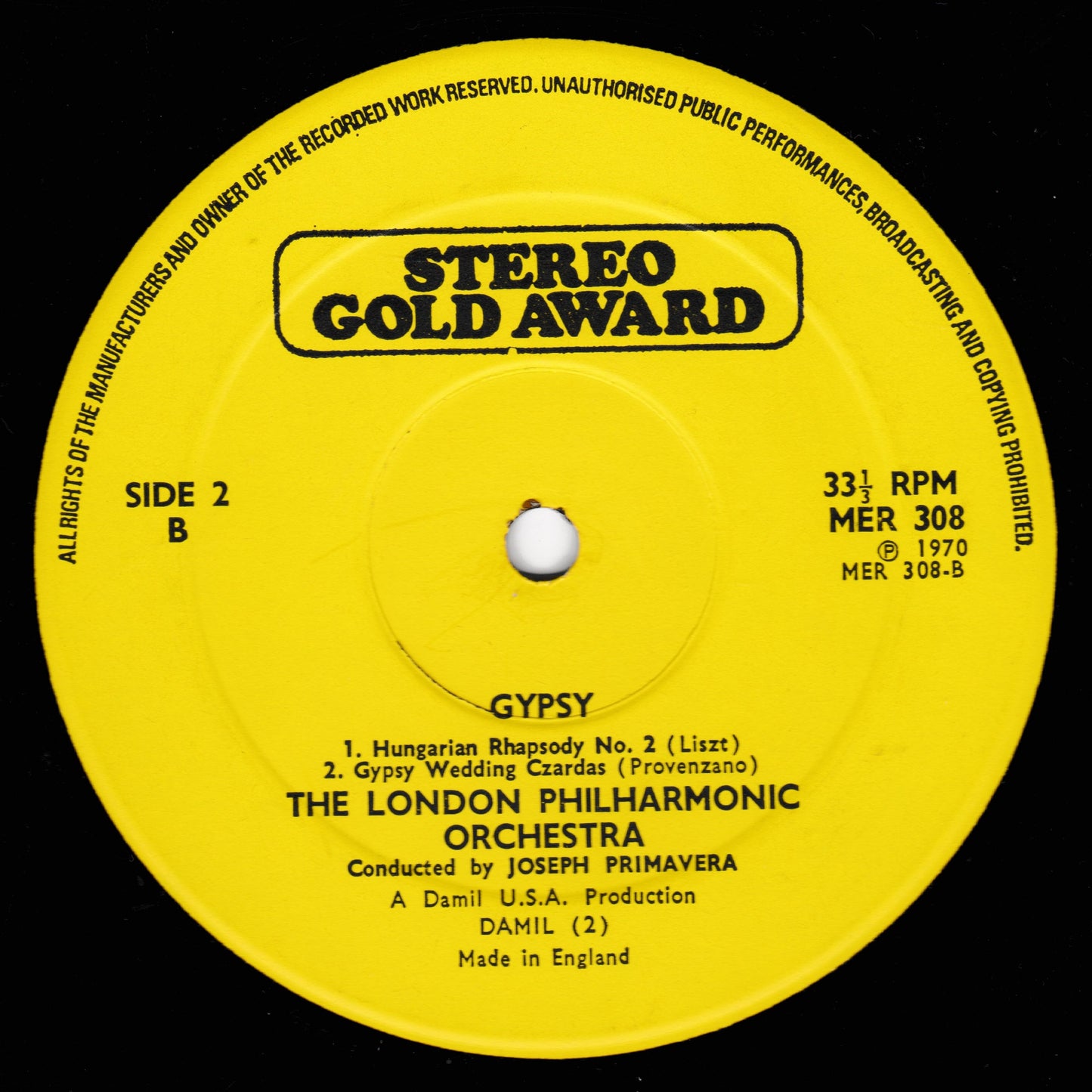 Yellow record label with text and music details on a black background
