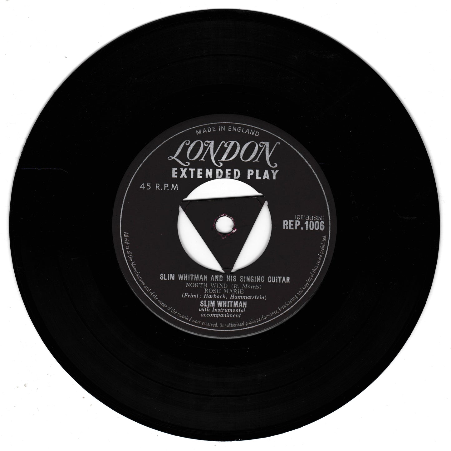 A black 45 RPM vinyl record with a white and black centre label reading 'London Extended Play' and 'Slim Whitman and his singing guitar', photographed on a plain white background.