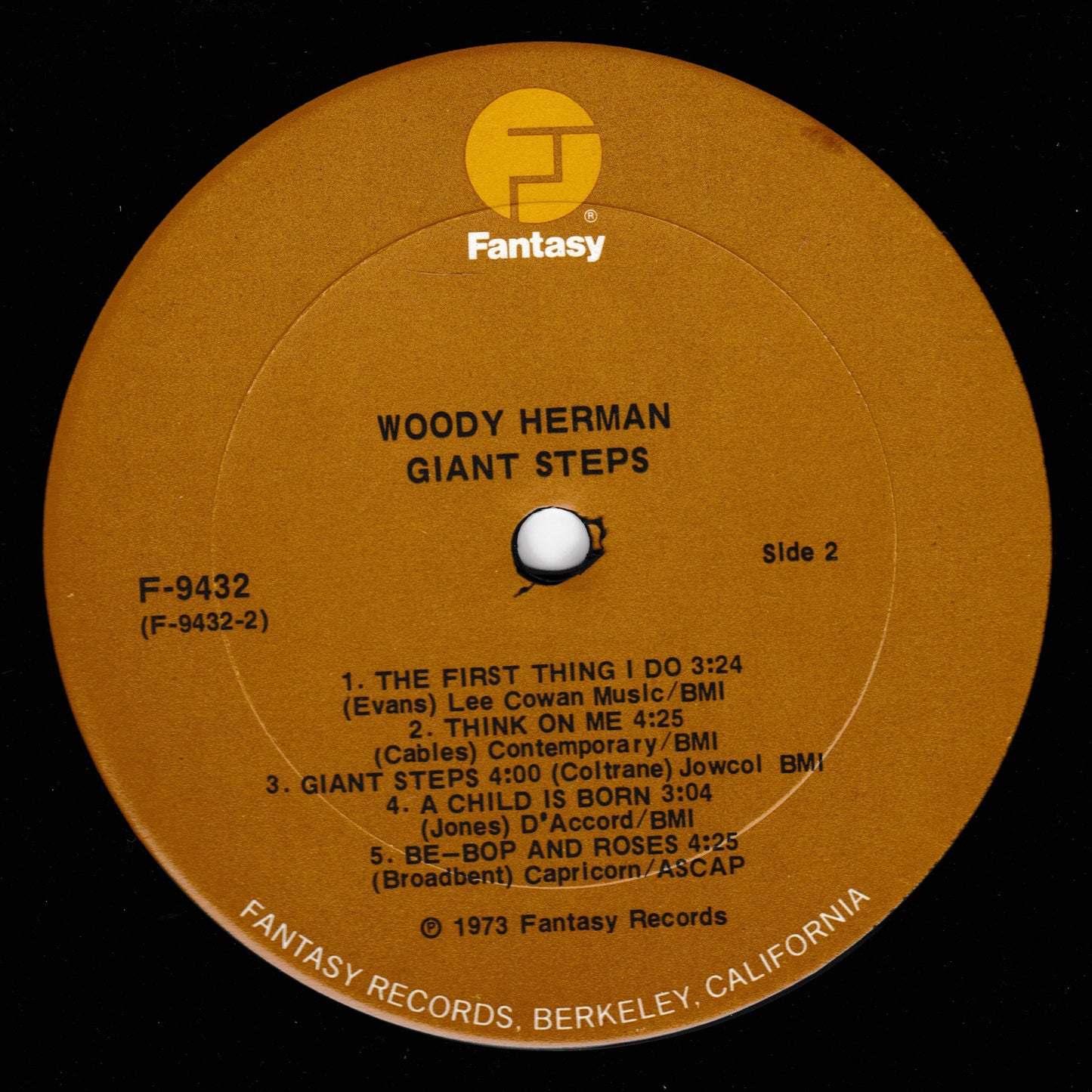 Round brown label with text and 'Fantasy' logo for Woody Herman's 'Giant Steps' album.