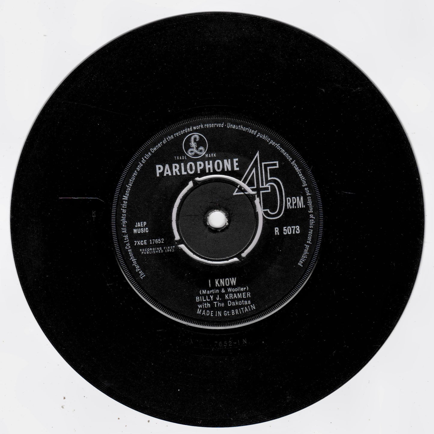 A vintage black 45 RPM vinyl record with a white Parlophone label, featuring the song 'I Know' by Billy J. Kramer and The Dakotas.
