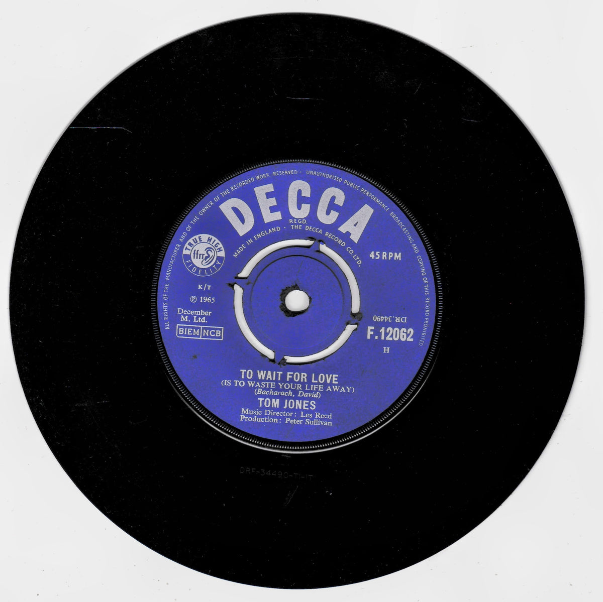 A black 45 RPM vinyl record with a blue and white Decca label, featuring Tom Jones's song 'To Wait for Love'.