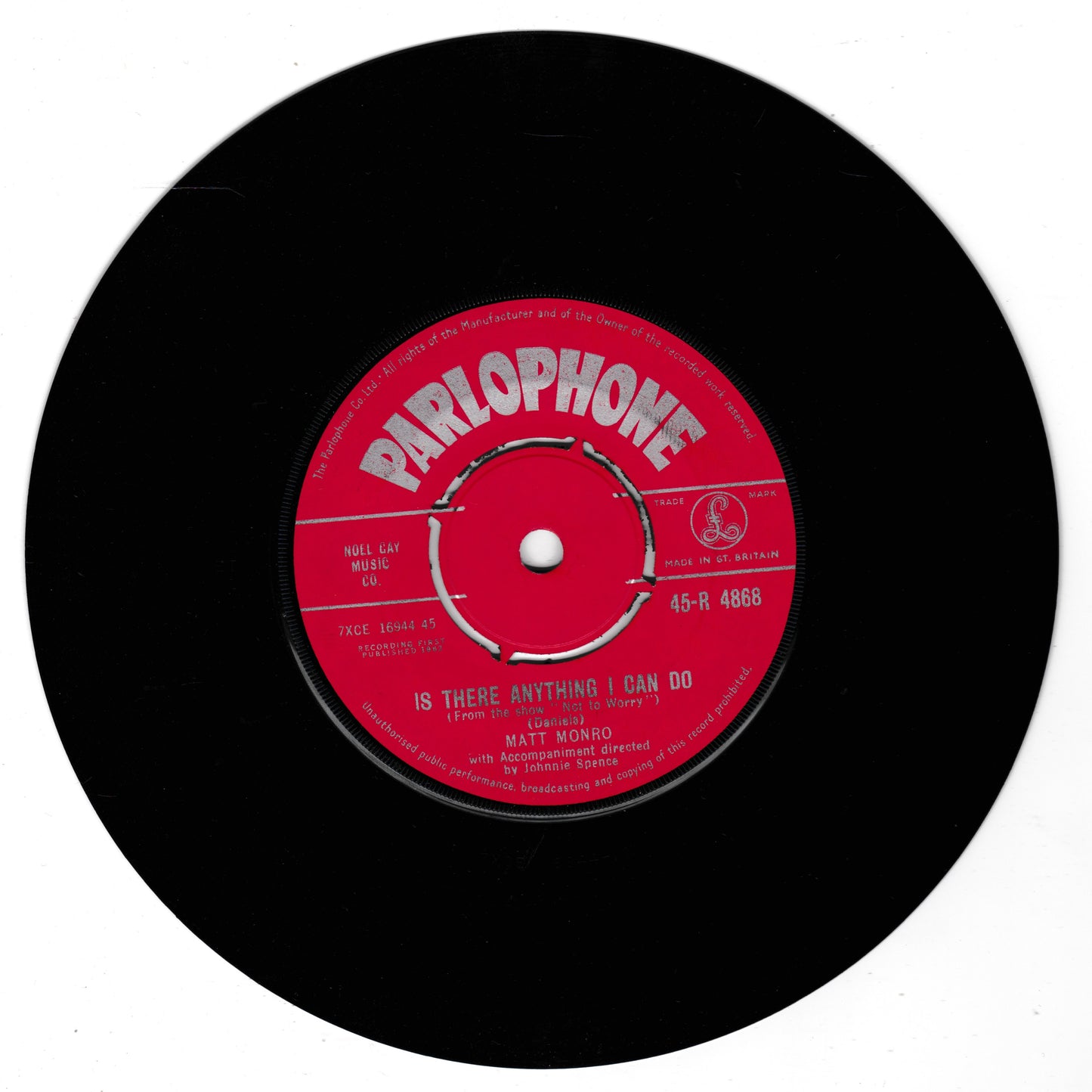 A black vinyl record with a bright red Parlophone label, featuring the song title 'IS THERE ANYTHING I CAN DO' by Matt Monro.