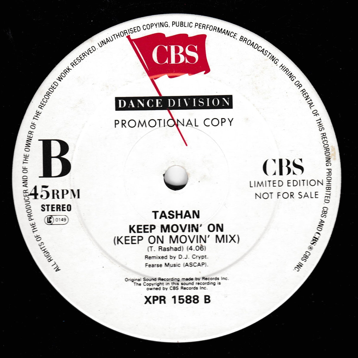 A close-up of a vinyl record label for Tashan's 'Keep On Movin' On (Keep On 'Mix)' from CBS Dance Division. The white circular label features black text and a red CBS logo, set against a black vinyl background.