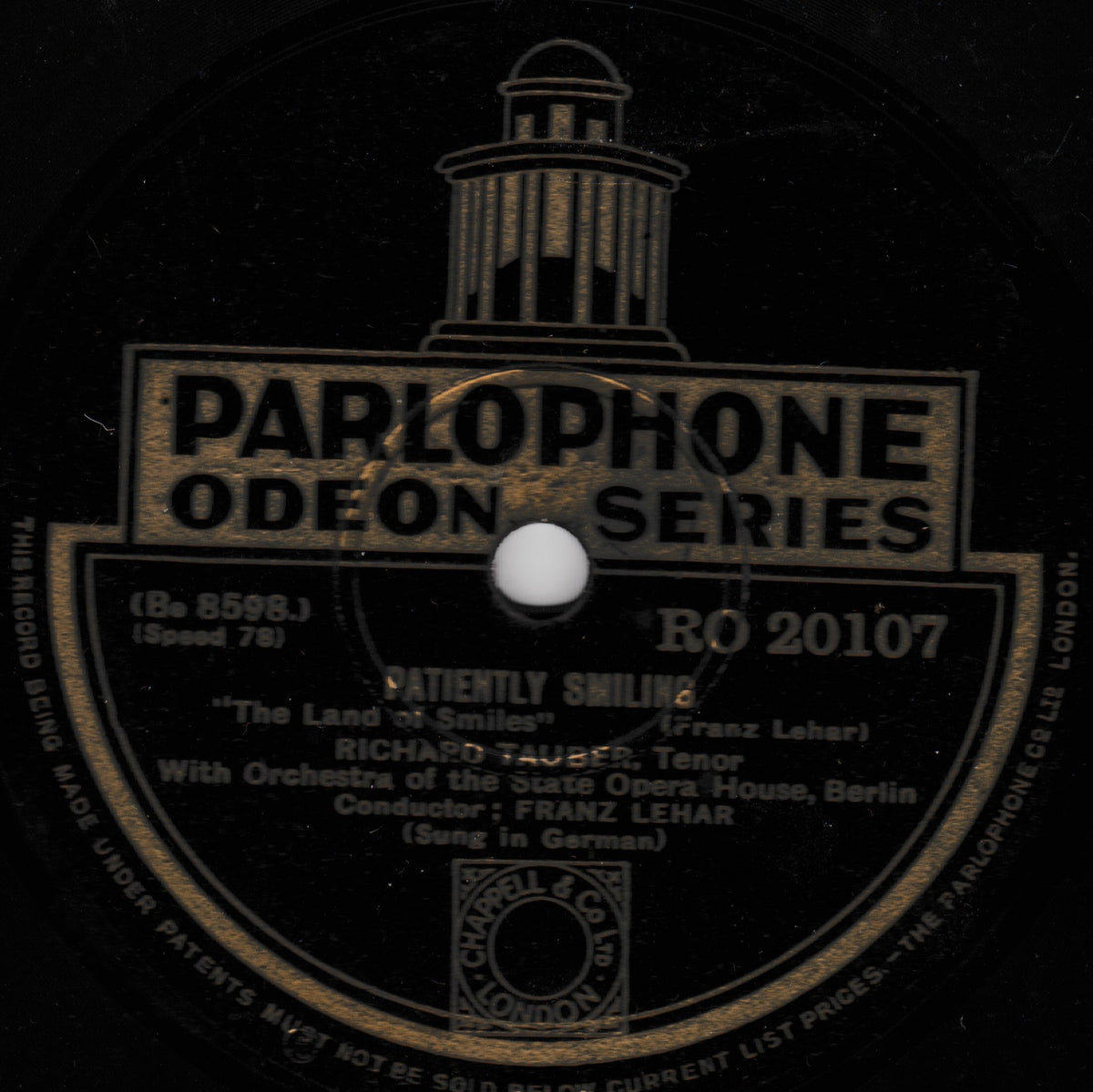 A vintage Parlophone Odeon Series 78 record label for Richard Tauber's tenon 'Patiently Smiling', featuring a black label with gold text and a central white spindle hole.