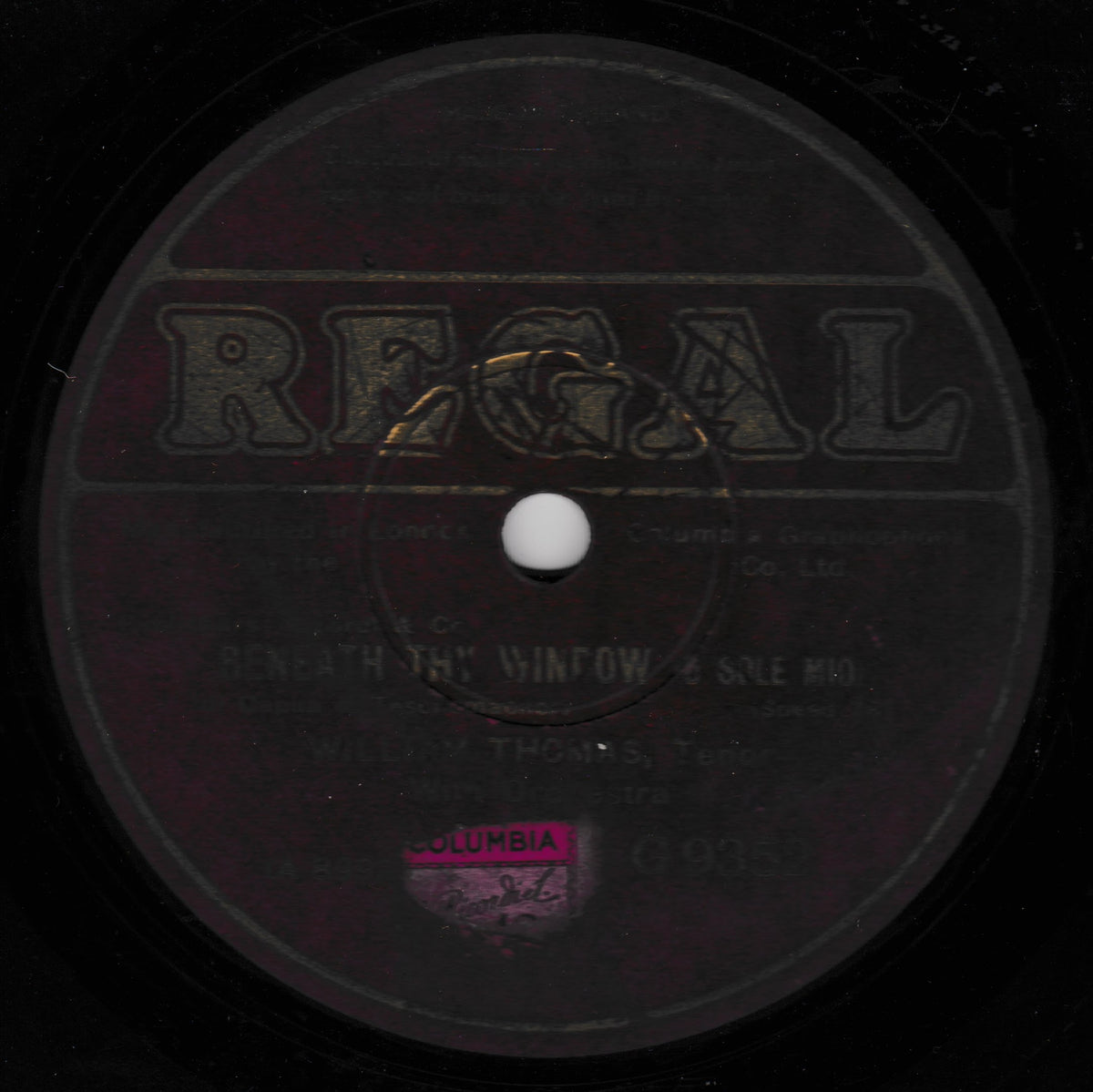 A vintage Regal record label with the title 'Beneath the Window' by Willy Thomas, featuring a black background and a pink Columbia sticker near the bottom.