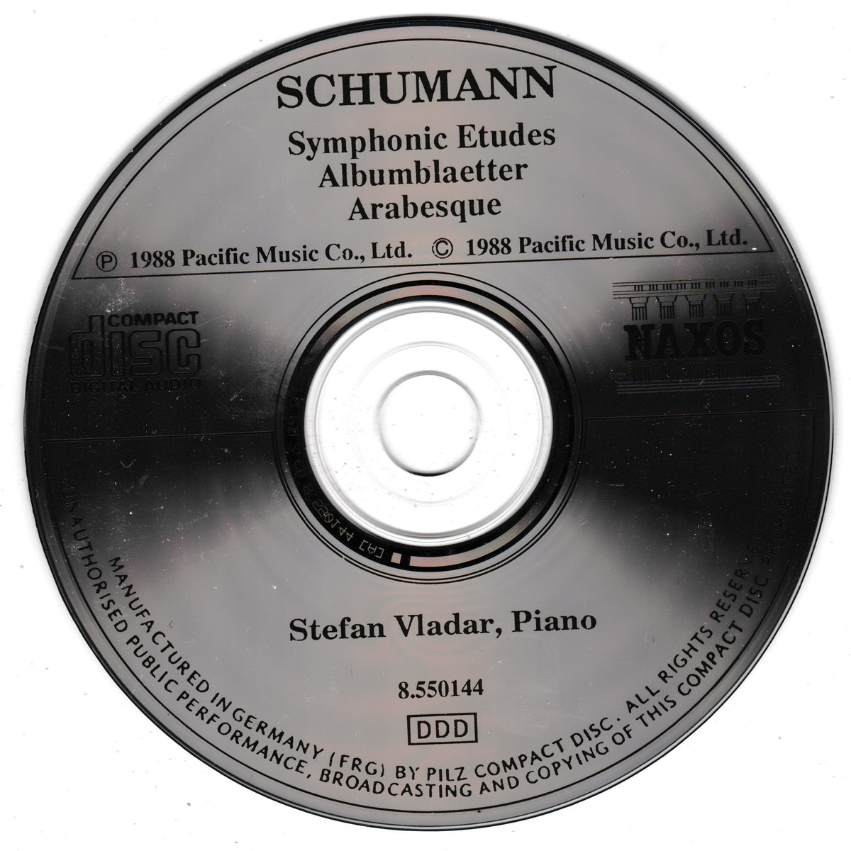 A compact disc for Schumann's 'Symphonic Etudes, Albumblätter, Arabesque' by Stefan Vladar, piano, with visible labels for Pacific Music Co. and Naxos.
