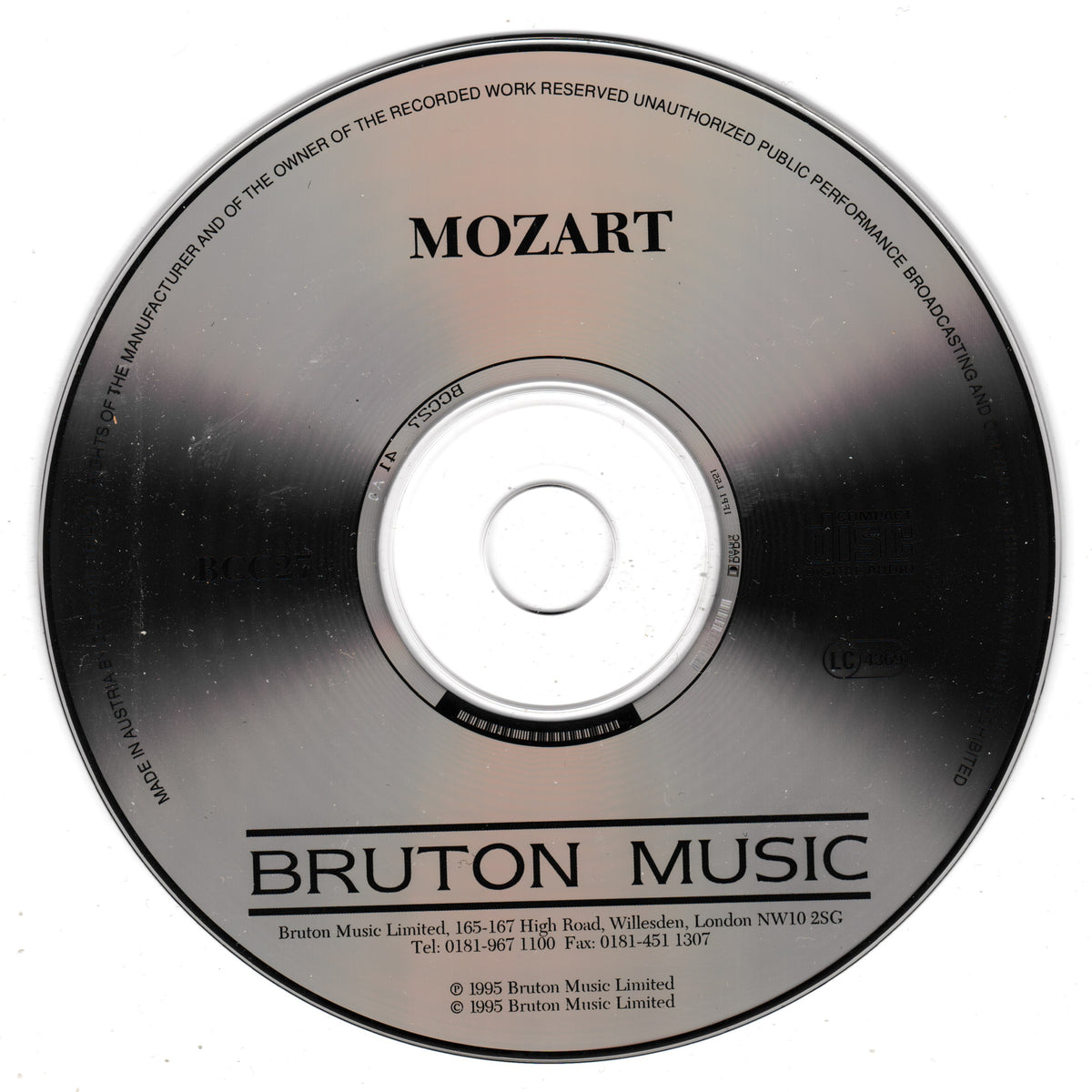 A close-up of a compact disc with the title MOZART at the top and BRUTON MUSIC at the bottom, photographed on a plain white background.