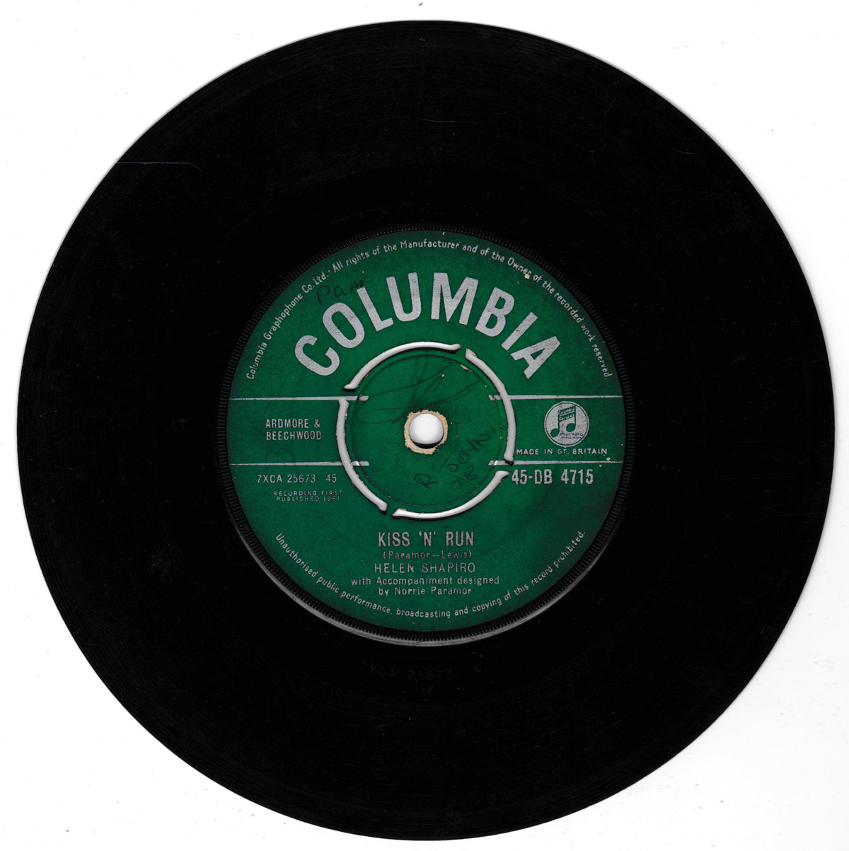 A vintage black 7-inch vinyl record with a green Columbia label, featuring the song 'Kiss 'N' Run' by Helen Shapiro.