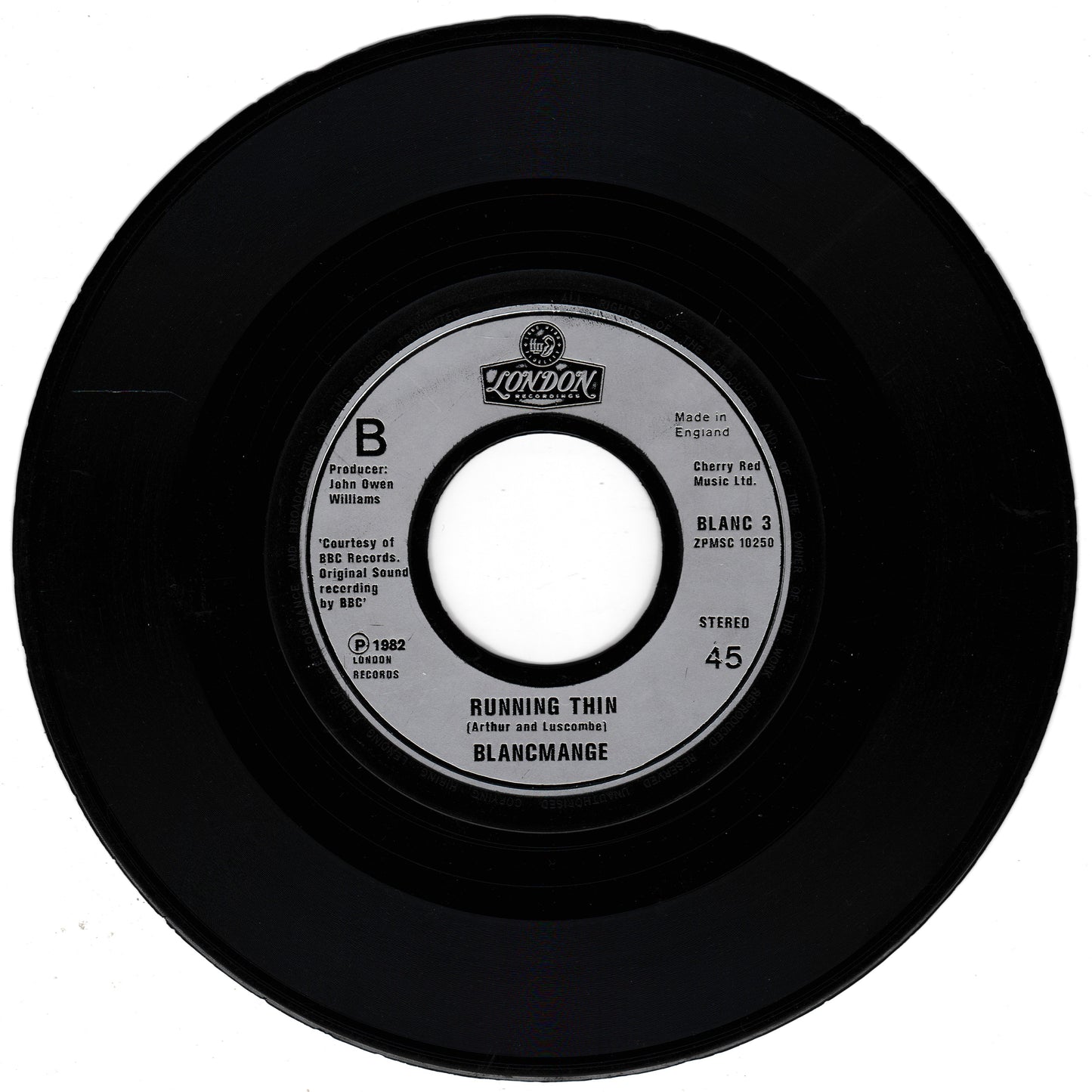 Black vinyl record with a label on a white background
