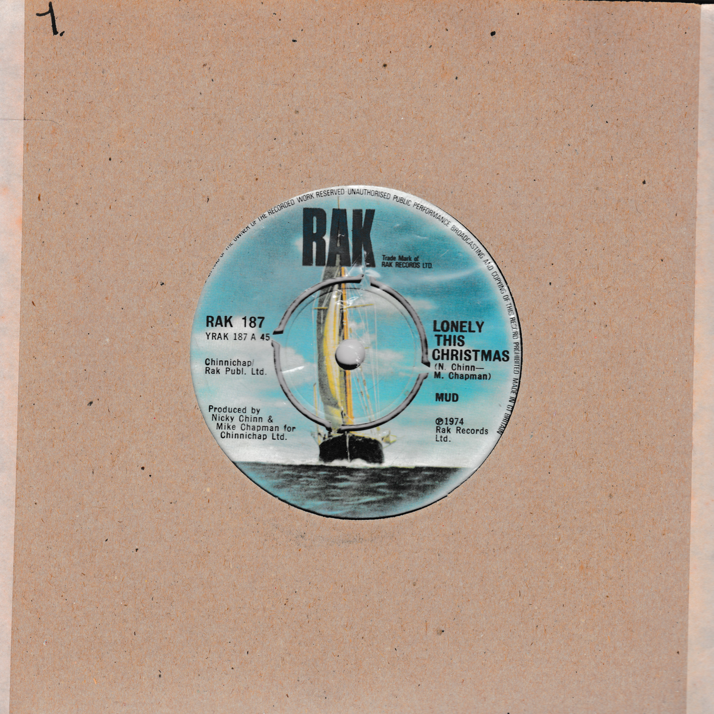 Vinyl record label with 'RAK' branding on a brown paper background