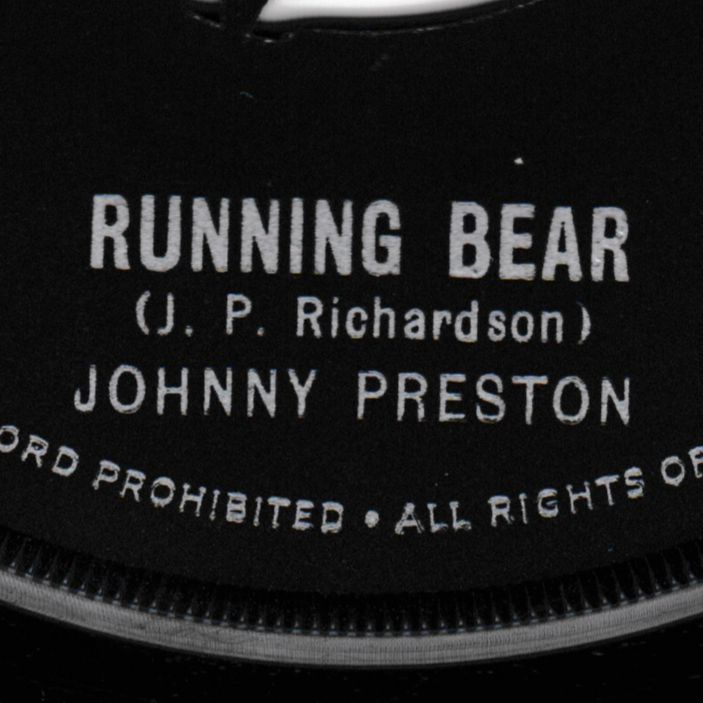 Close-up of a record label with 'Running Bear' branding.