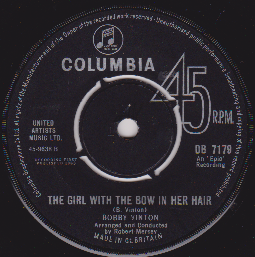Record label for a Columbia 45 RPM record featuring Bobby Vinton's 'The Girl with the Bow in Her Hair'.