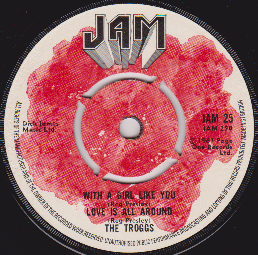 Record label with red center and white text on a black background