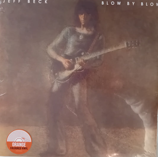 Album cover of 'Blow by Blow' by Jeff Beck with a person playing guitar.