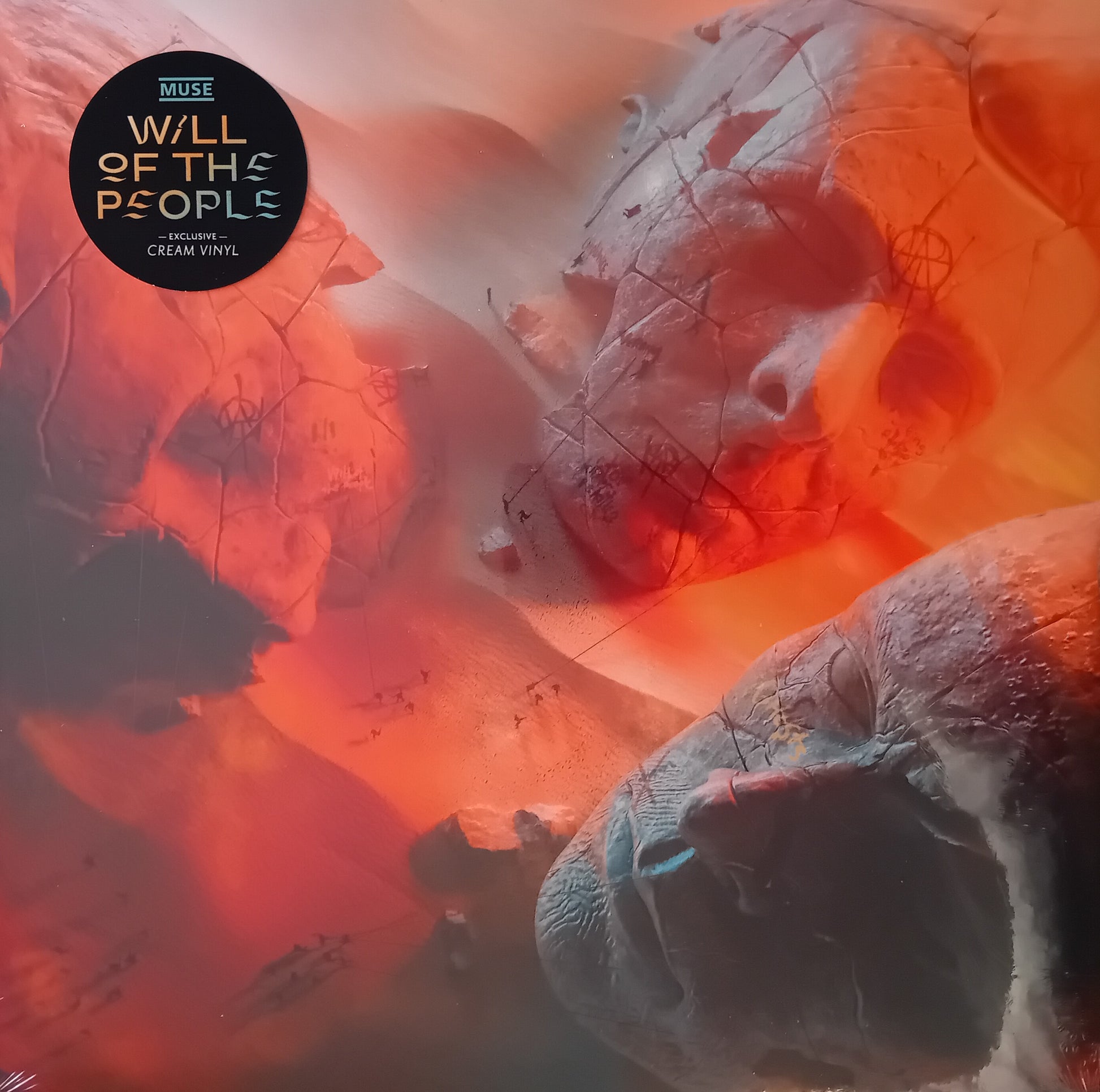 Album cover for 'Will of the People' by Muse with abstract design and text.