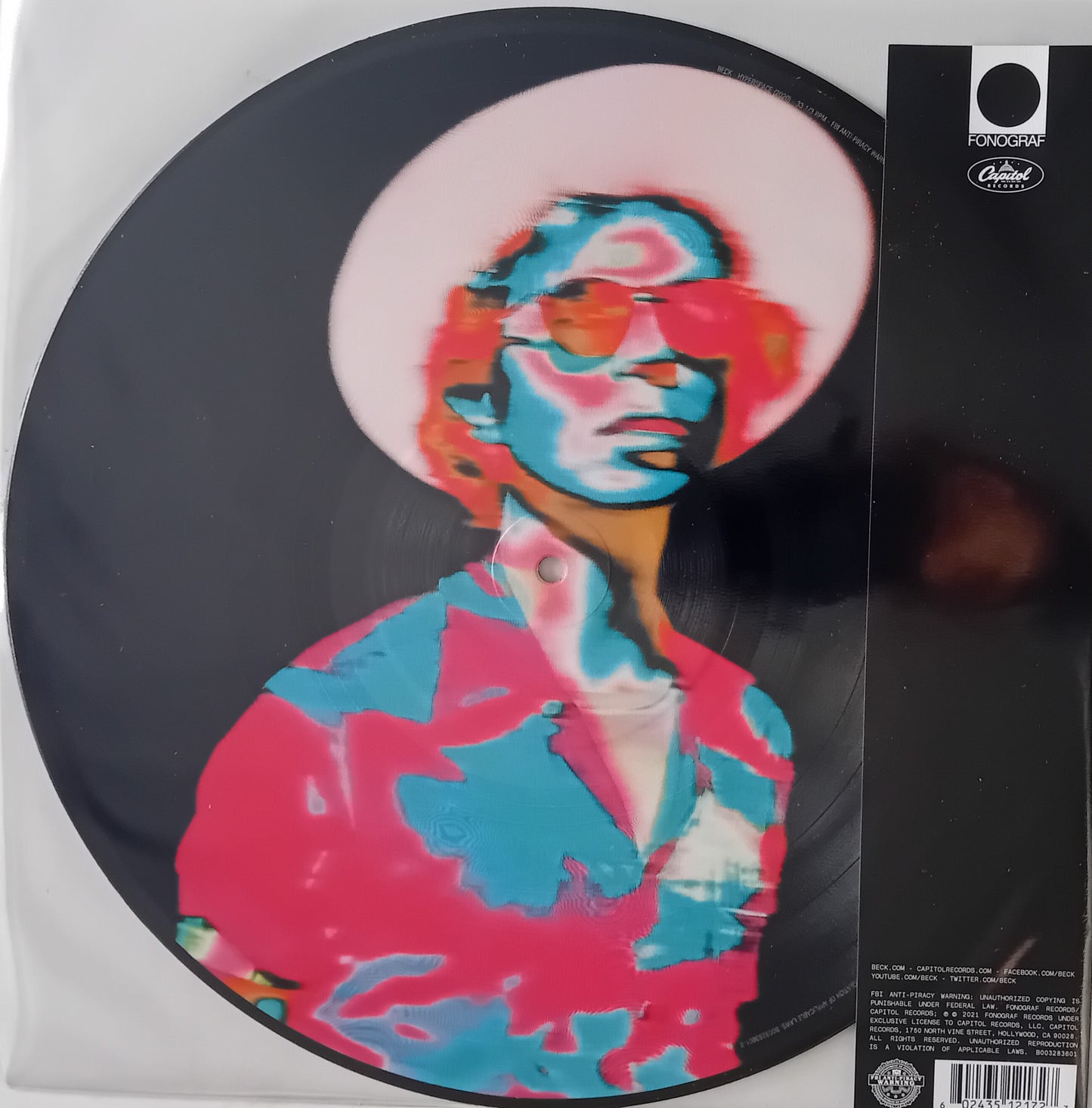 Vinyl record with a colorful portrait design on a white background