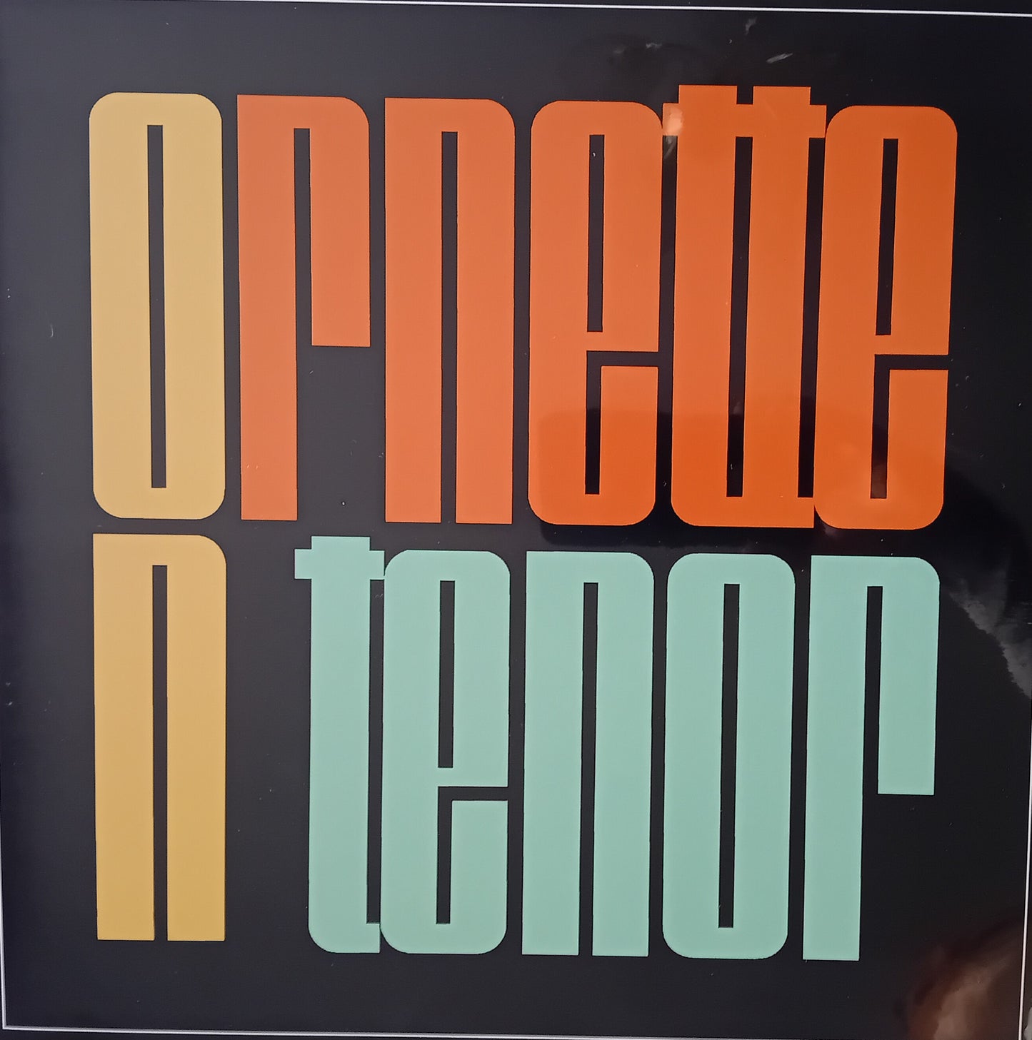 Album cover with 'Ornette' in orange and 'Tenor' in green on a black background