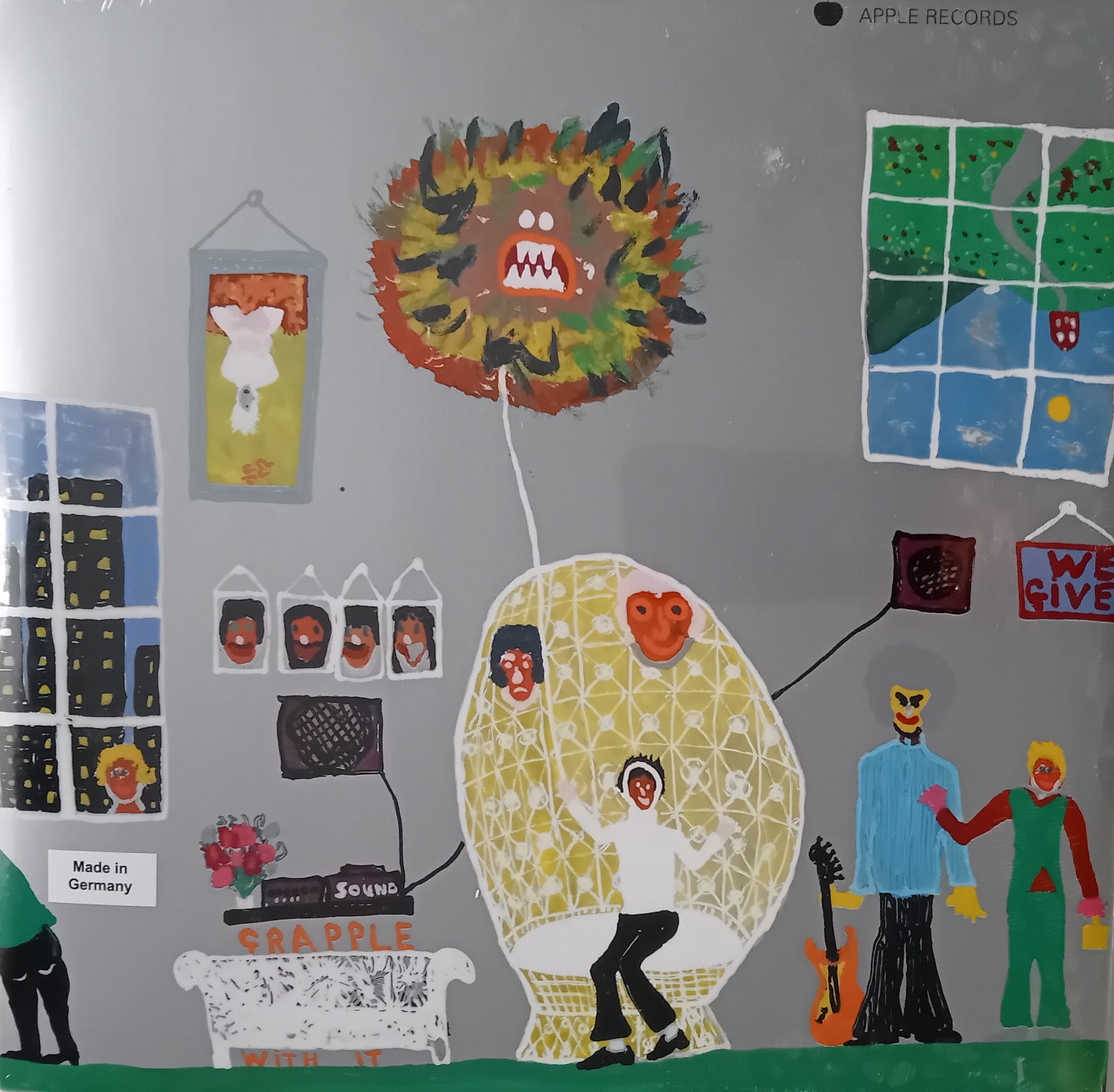 Illustrated album cover with colorful characters and a dragon-like creature on a gray background.