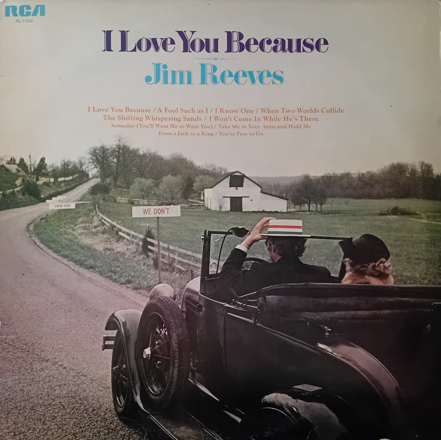 Album cover of 'I Love You Because' by Jim Reeves with a vintage car and landscape.